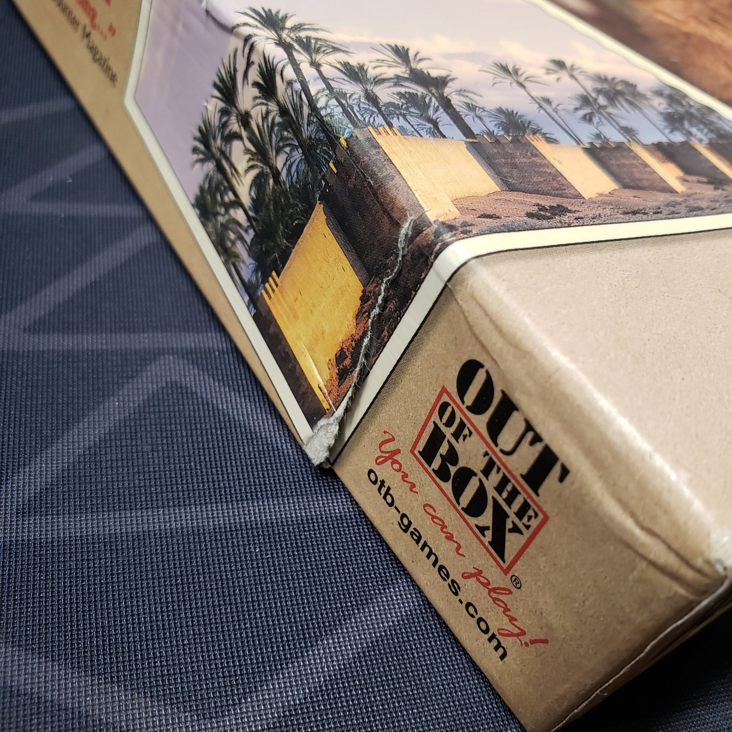 Image shows a tear in the side of the box for the 10 Days in Africa board game