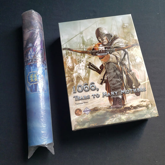 Image shows the front cover of the box of the 1066: Tears to Many Mothers card game with the playmat sitting rolled beside it