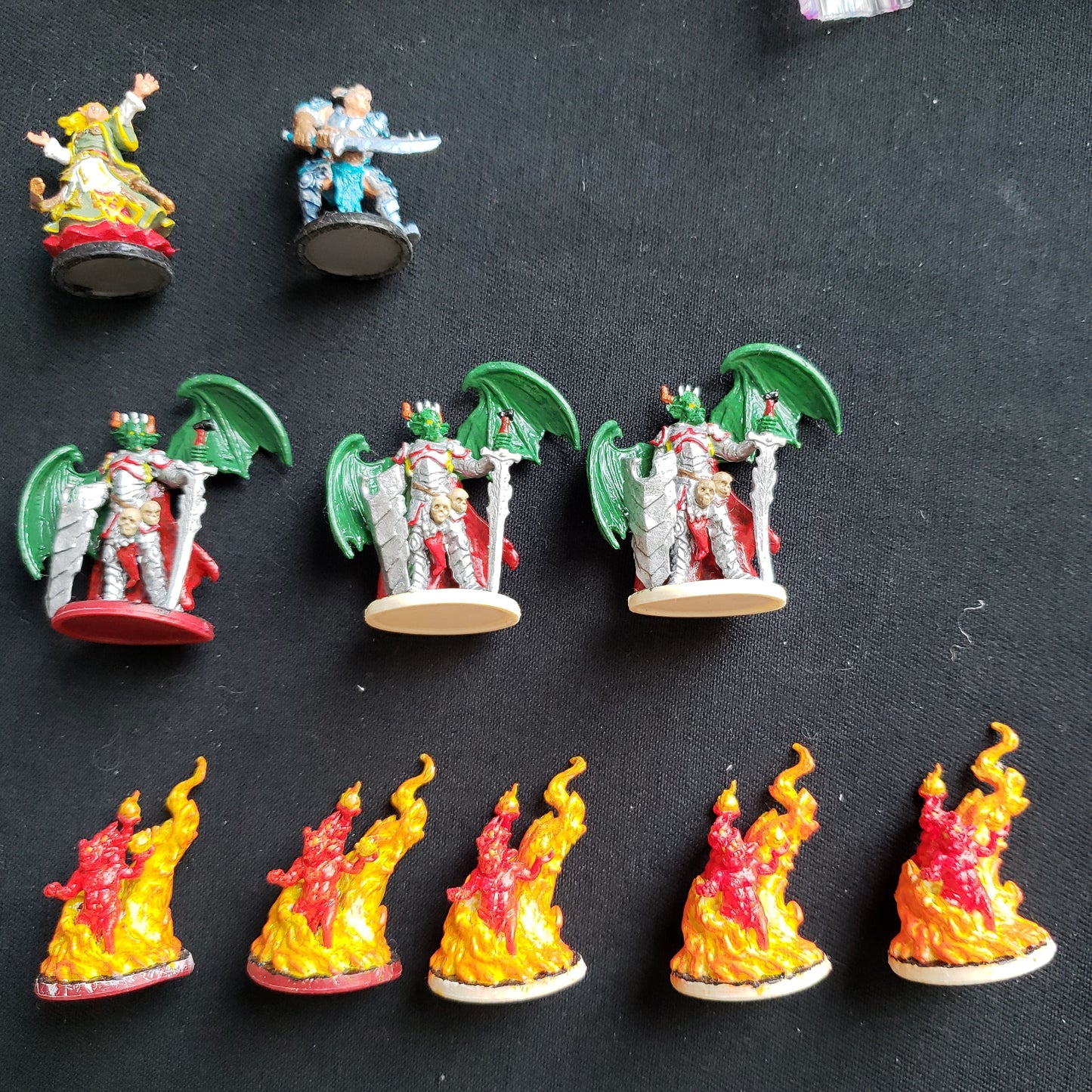 Image shows the miniatures from the Lair of the Wyrm expansion painted.