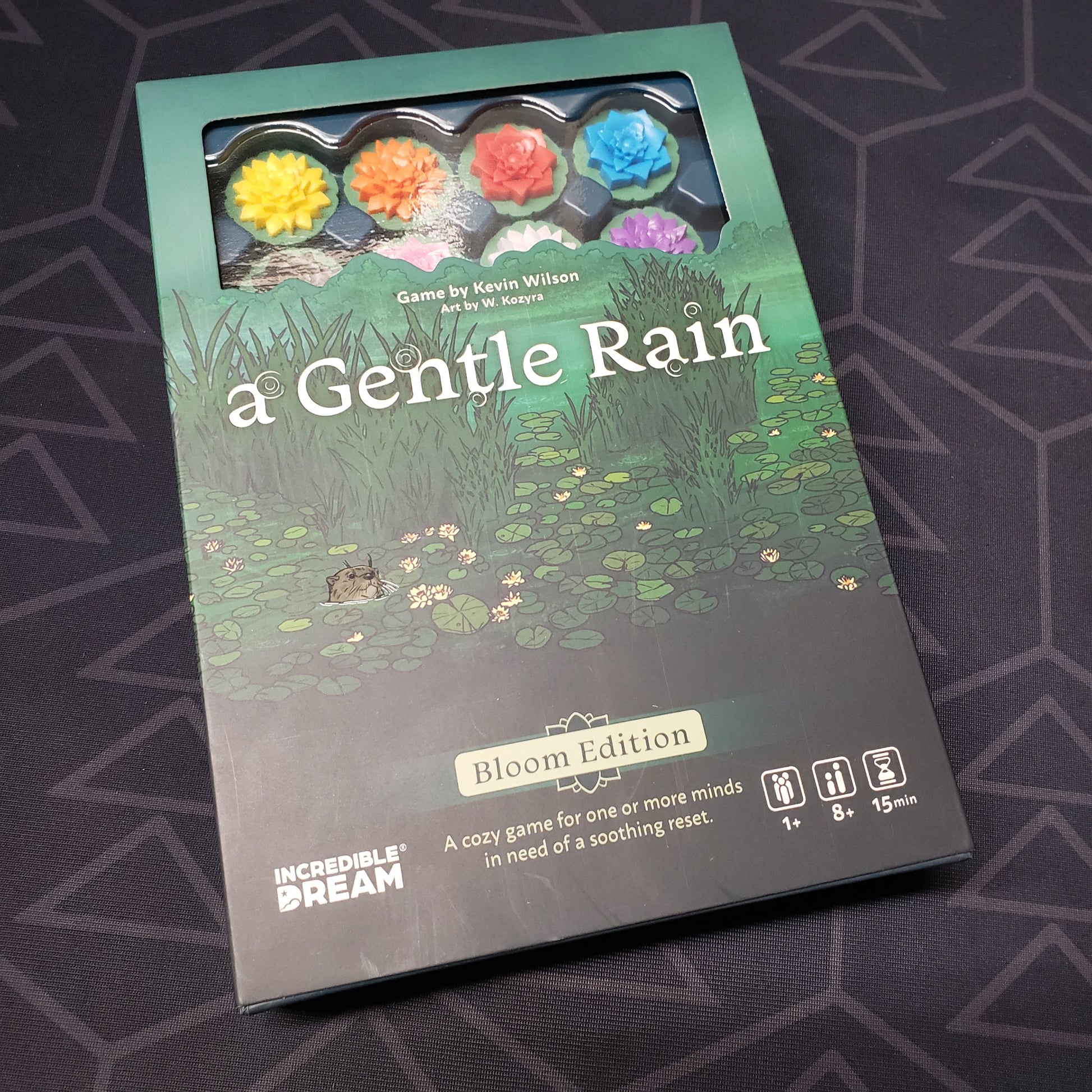 Image shows the front cover of the box for the A Gentle Rain (Bloom Edition) board game