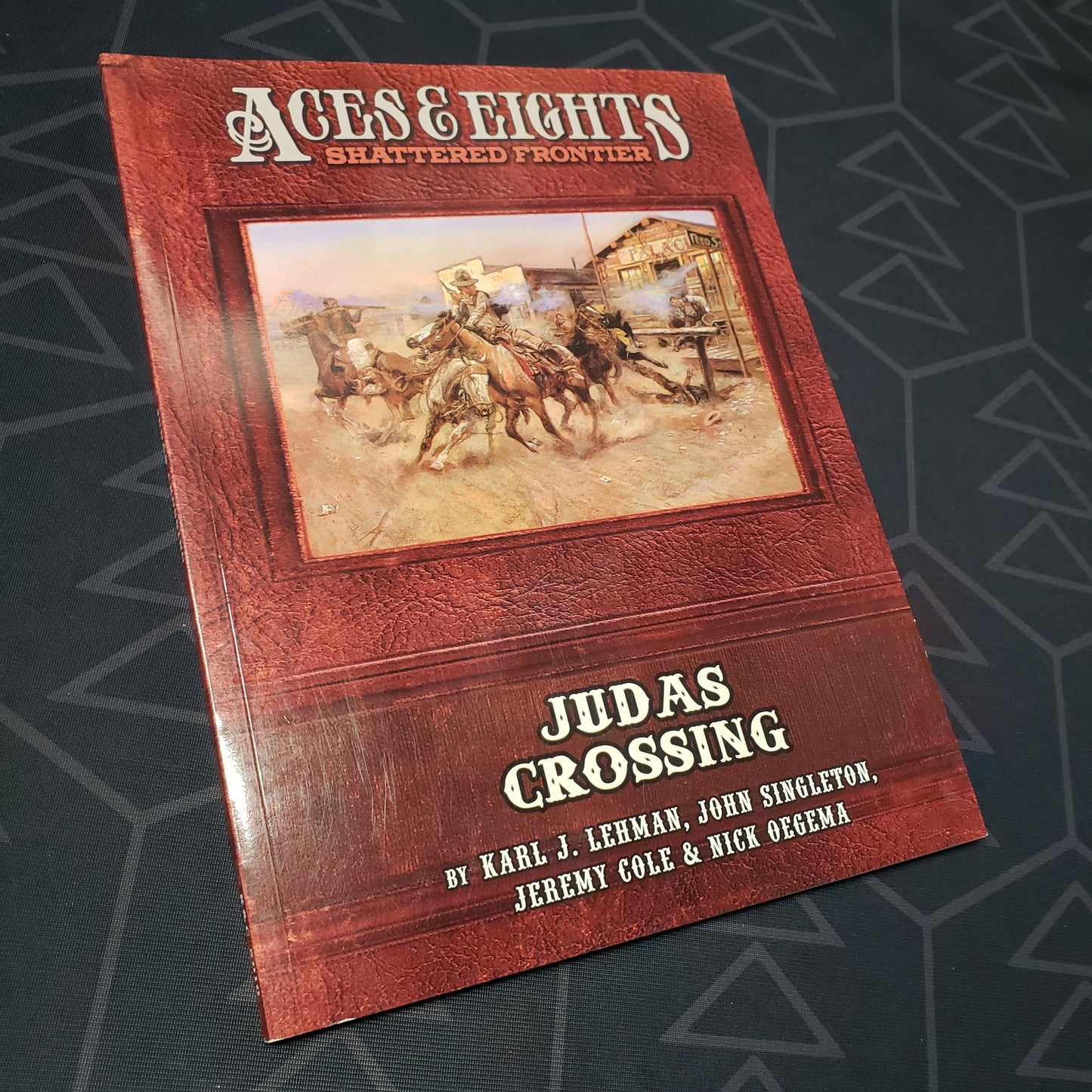Image shows the front cover of the Judas Crossing book for the roleplaying game Aces & Eights: Shattered Frontier