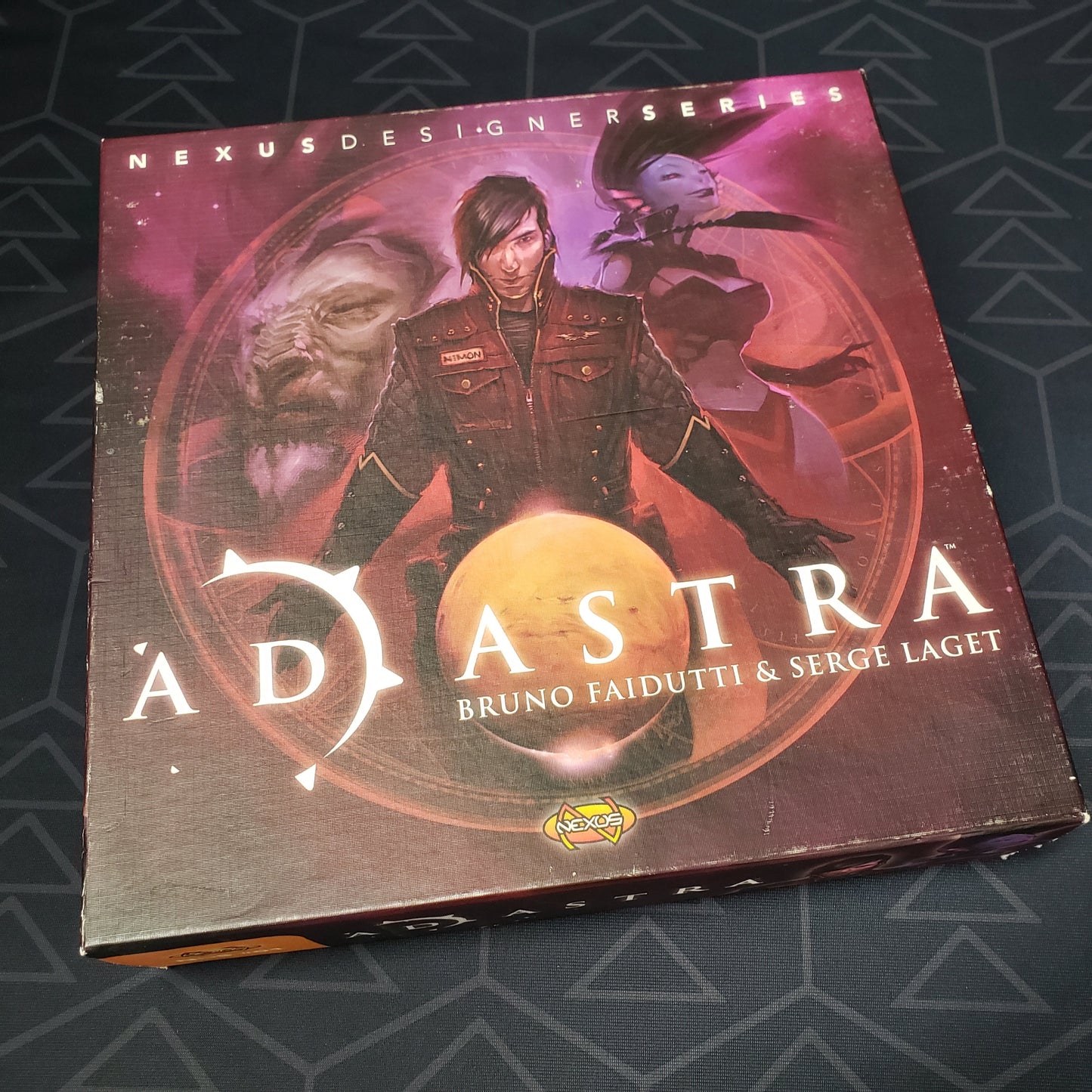 Image shows the front cover of the box of the Ad Astra board game