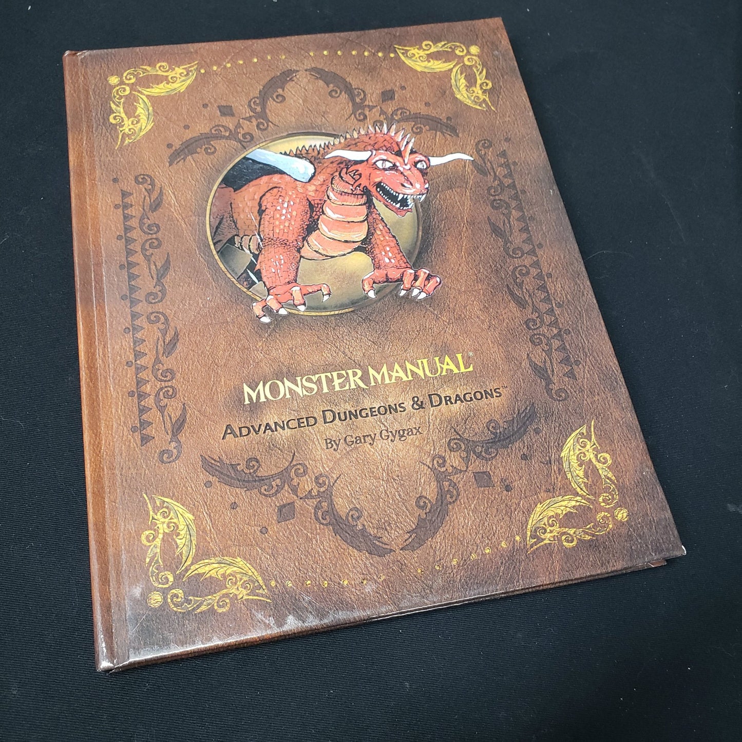 Image shows the front cover of the 2012 Reprint Monster Manual for the roleplaying game Advanced Dungeons & Dragons: First Edition