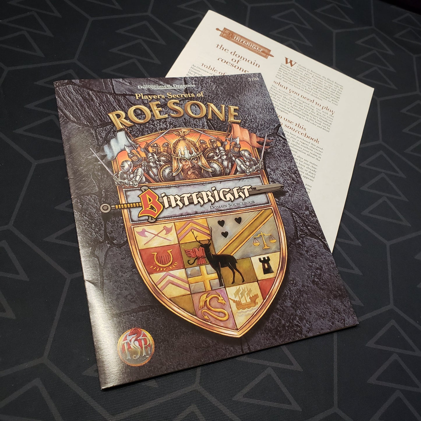 Image shows the front cover of the folio for the Birthright: Player's Secrets of Roesone adventure module for the roleplaying game Advanced Dungeons & Dragons 1E with the booklet fanned out