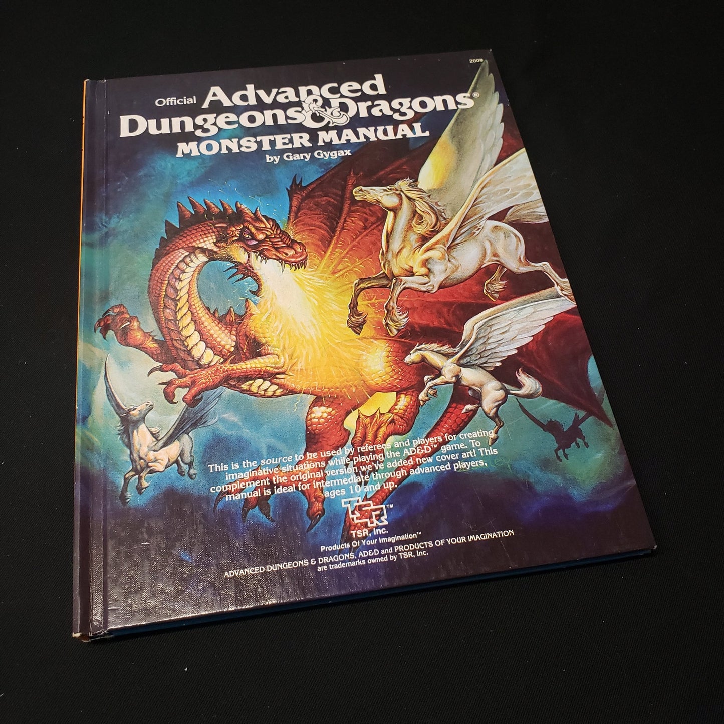 Image shows the front cover of the Monster Manual book for the roleplaying game Advanced Dungeons & Dragons: First Edition