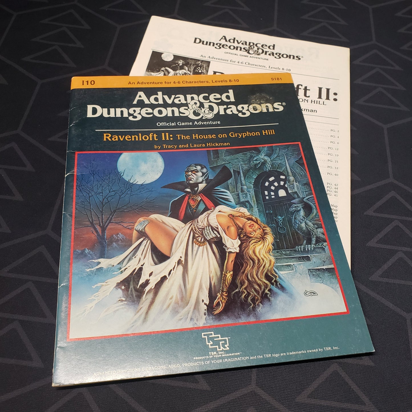 Image shows the front cover of the folio for the Ravenloft II: The House on Gryphon Hill adventure module for the roleplaying game Advanced Dungeons & Dragons: First Edition, with the booklet fanned out