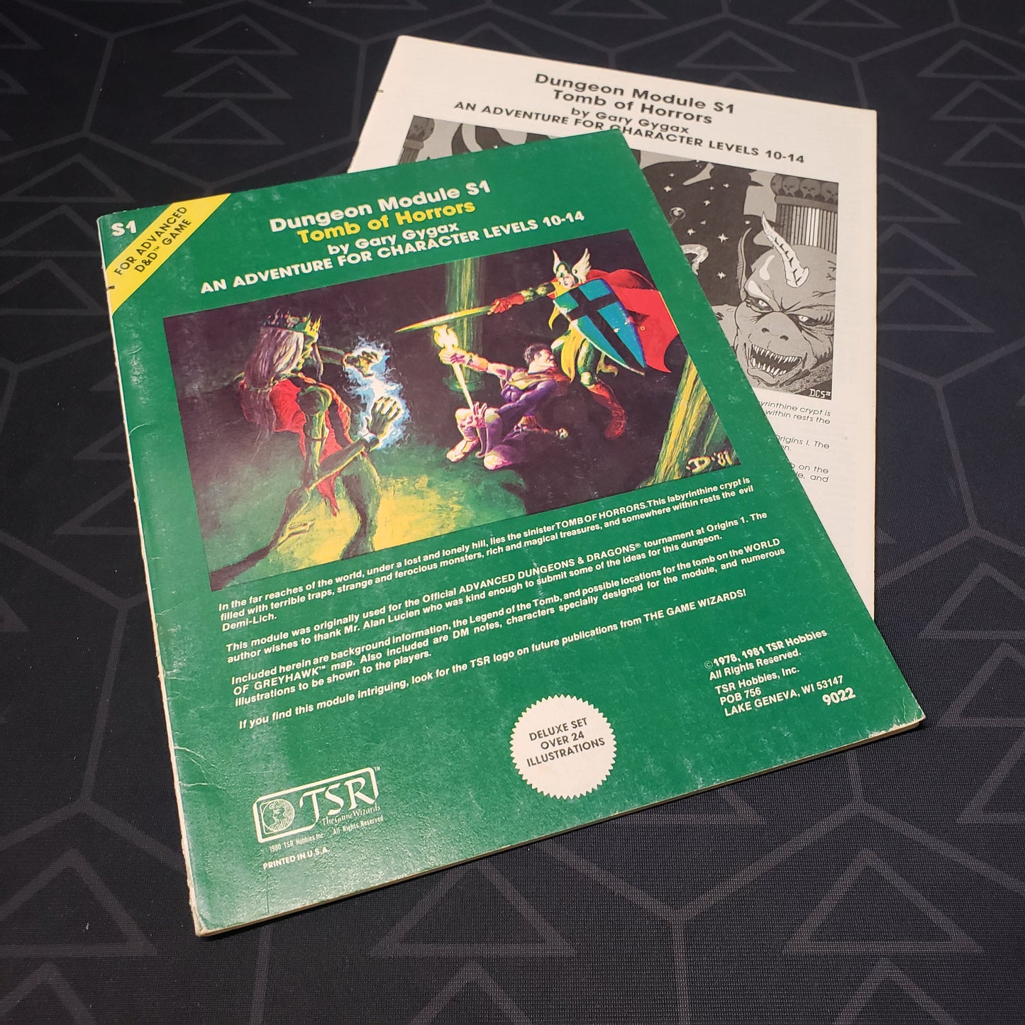Image shows the front cover of the folio for the Tomb of Horrors adventure module for the roleplaying game Advanced Dungeons & Dragons 1E with the booklet fanned out