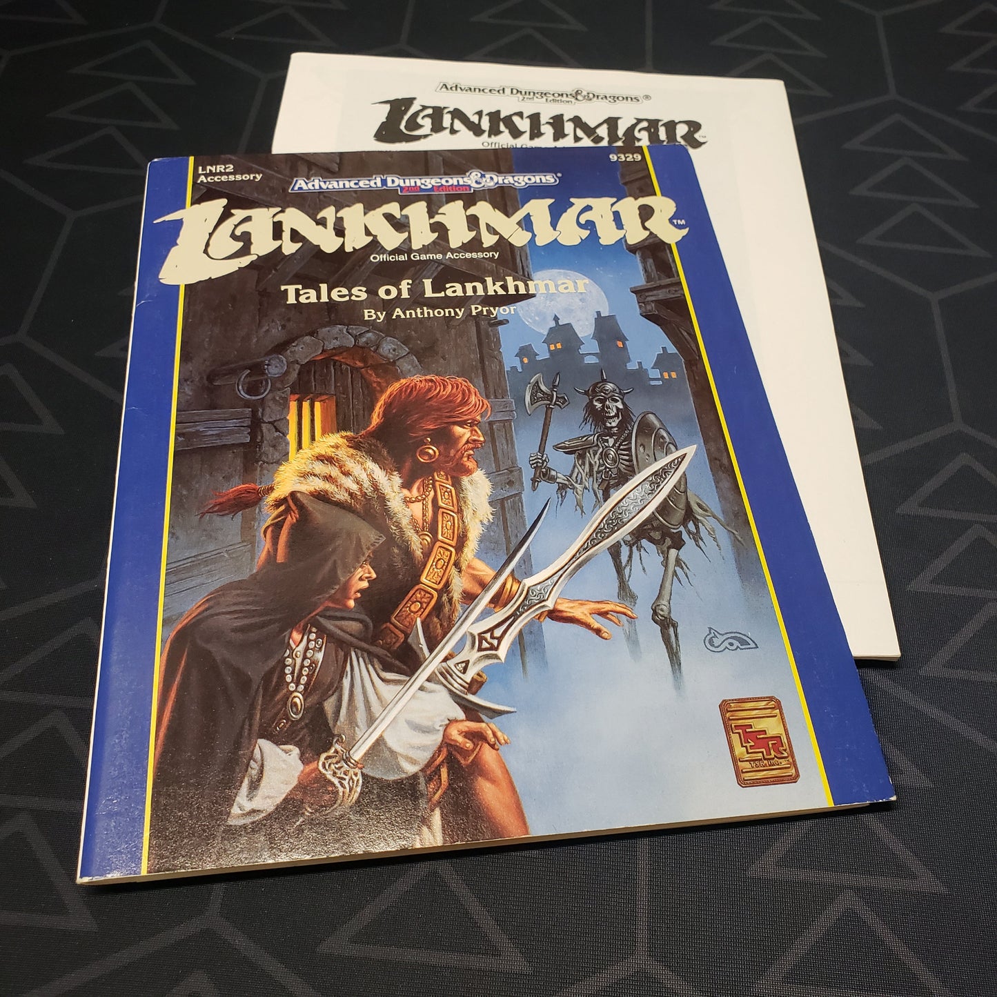 Image shows the front cover of the folio for the Tales of Lankhmar adventure module for the roleplaying game Advanced Dungeons & Dragons: Second Edition, with the booklet fanned out