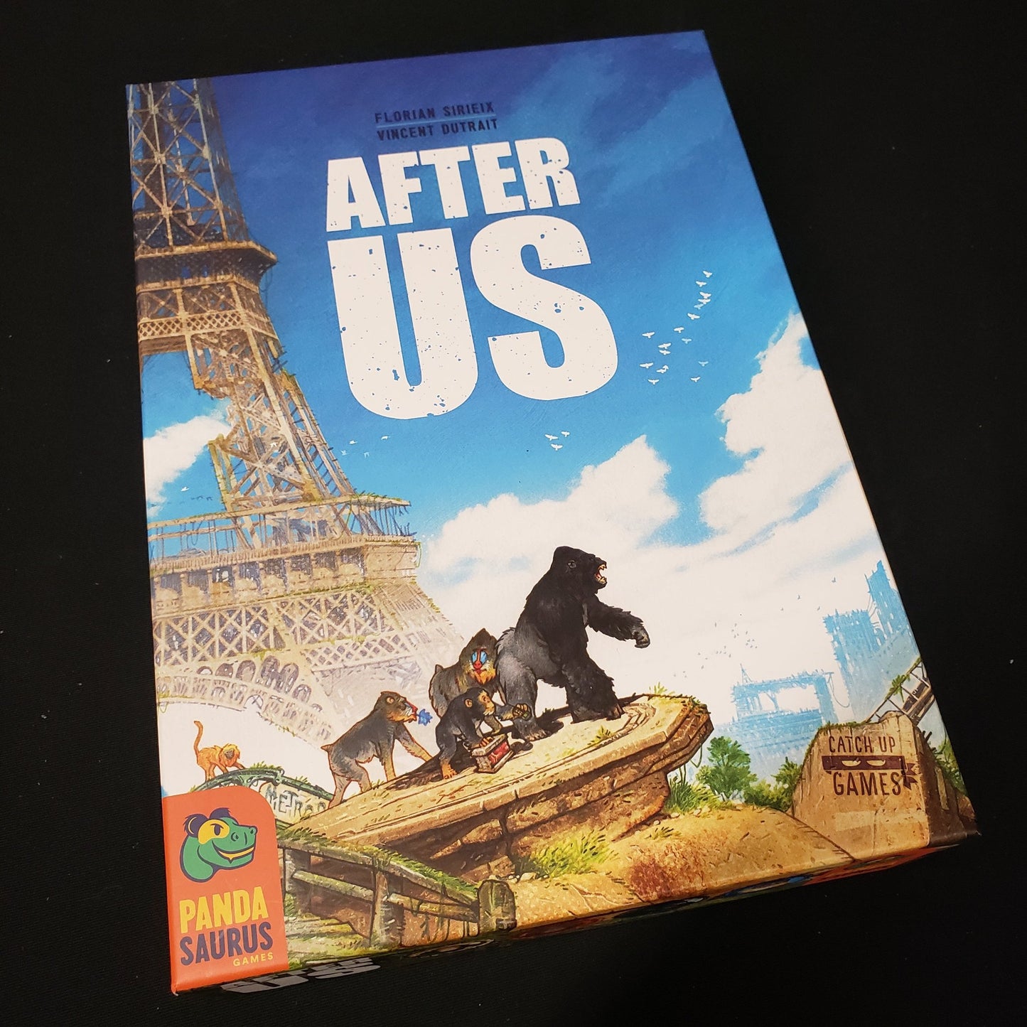 Image shows the front cover of the box of the After Us board game