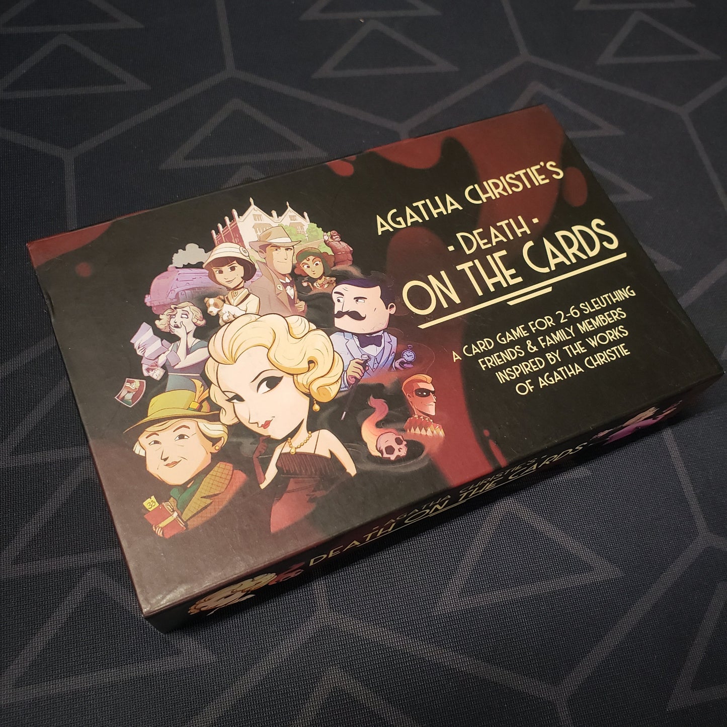 Image shows the front cover of the box for the Agatha Christie's Death on the Cards card game