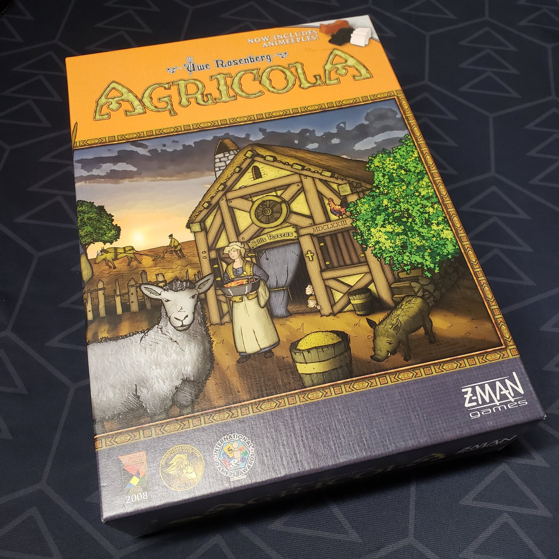 Image shows the front cover of the box of the Agricola board game