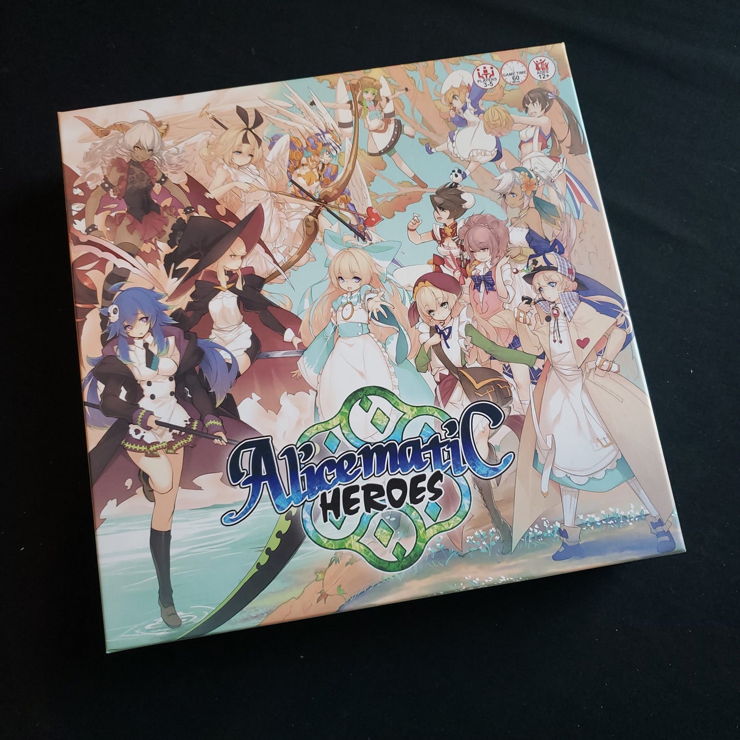 Image shows the front cover of the box of the Alicematic Heroes board game
