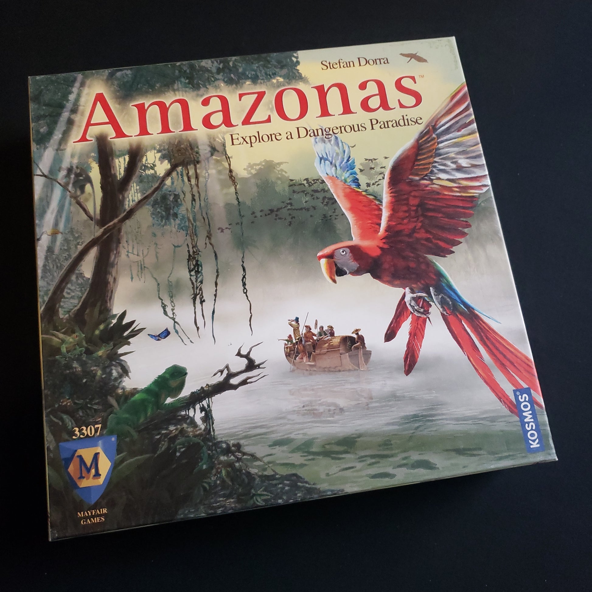 Image shows the front cover of the box of the Amazonas board game