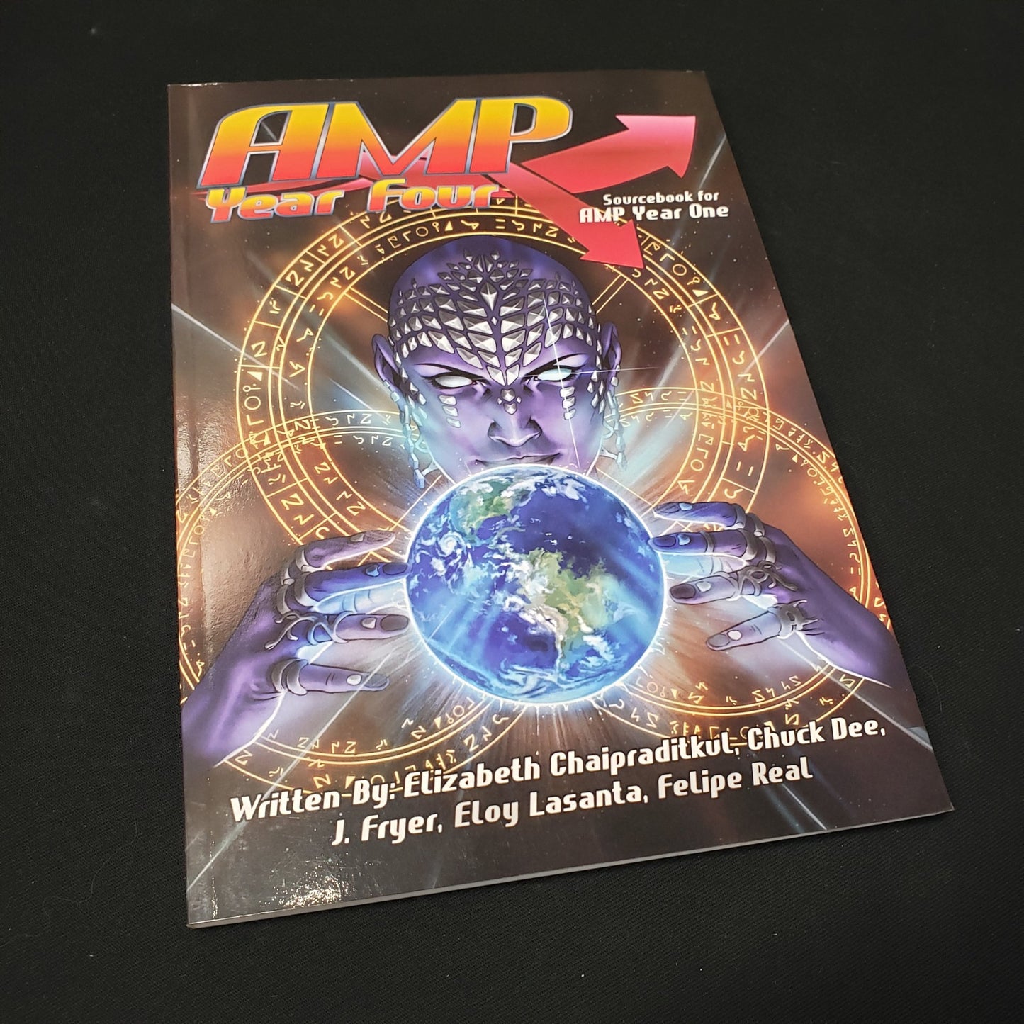 Image shows the front cover of the AMP: Year Four book for the roleplaying game AMP: Year One
