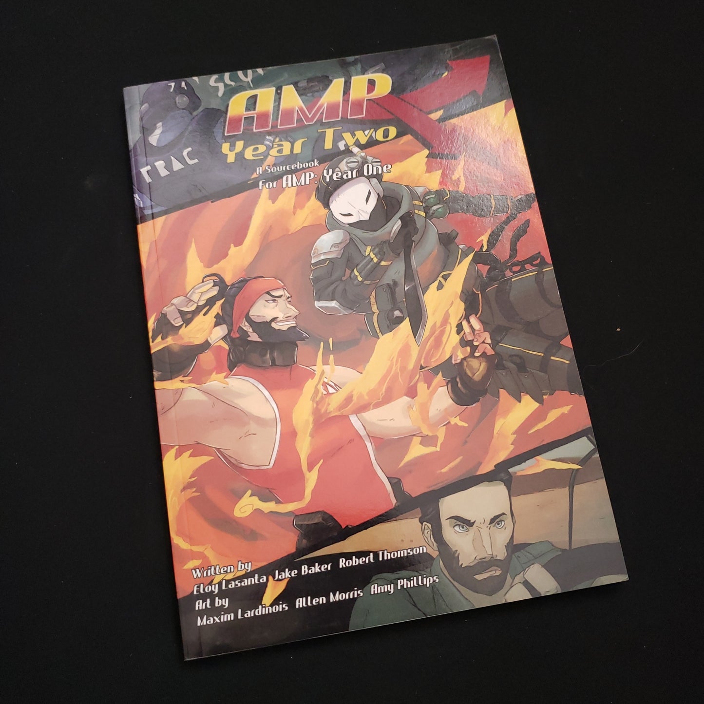 Image shows the front cover of the AMP: Year Two book for the AMP Year One roleplaying game