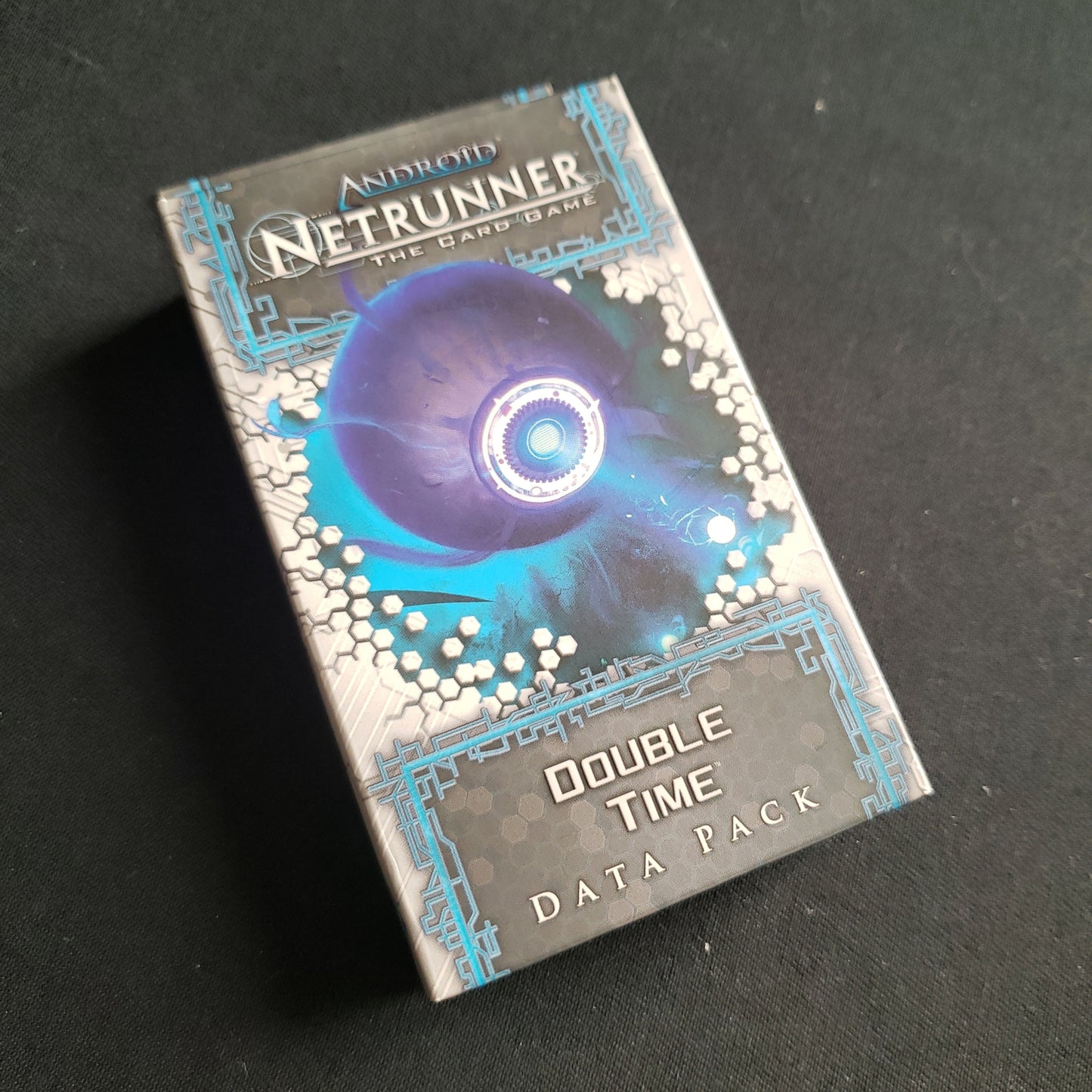 Image shows the front of the package for the Double Time Data Pack for the Android: Netrunner card game