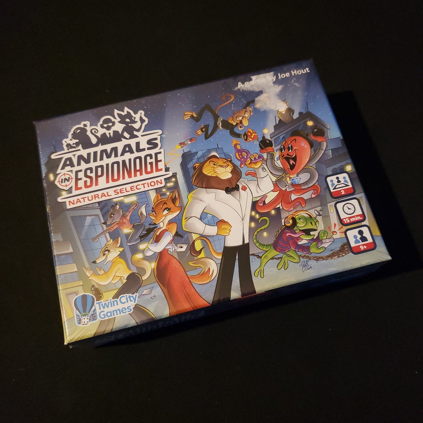 Image shows the front cover of the box of the Animals in Espionage card game