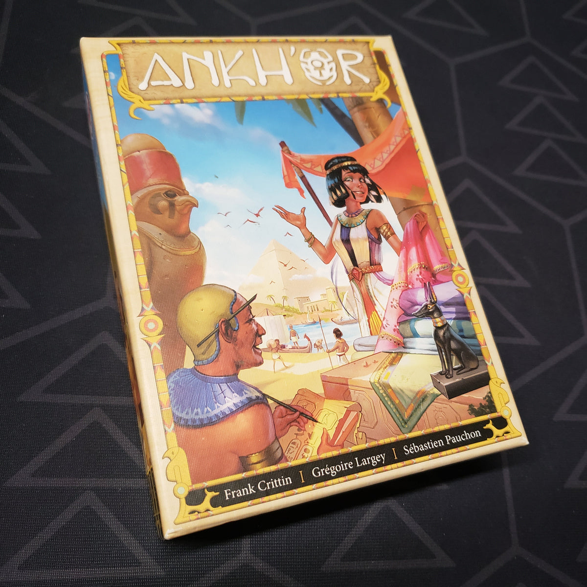 Image shows the front cover of the box for the Ankh'or board game
