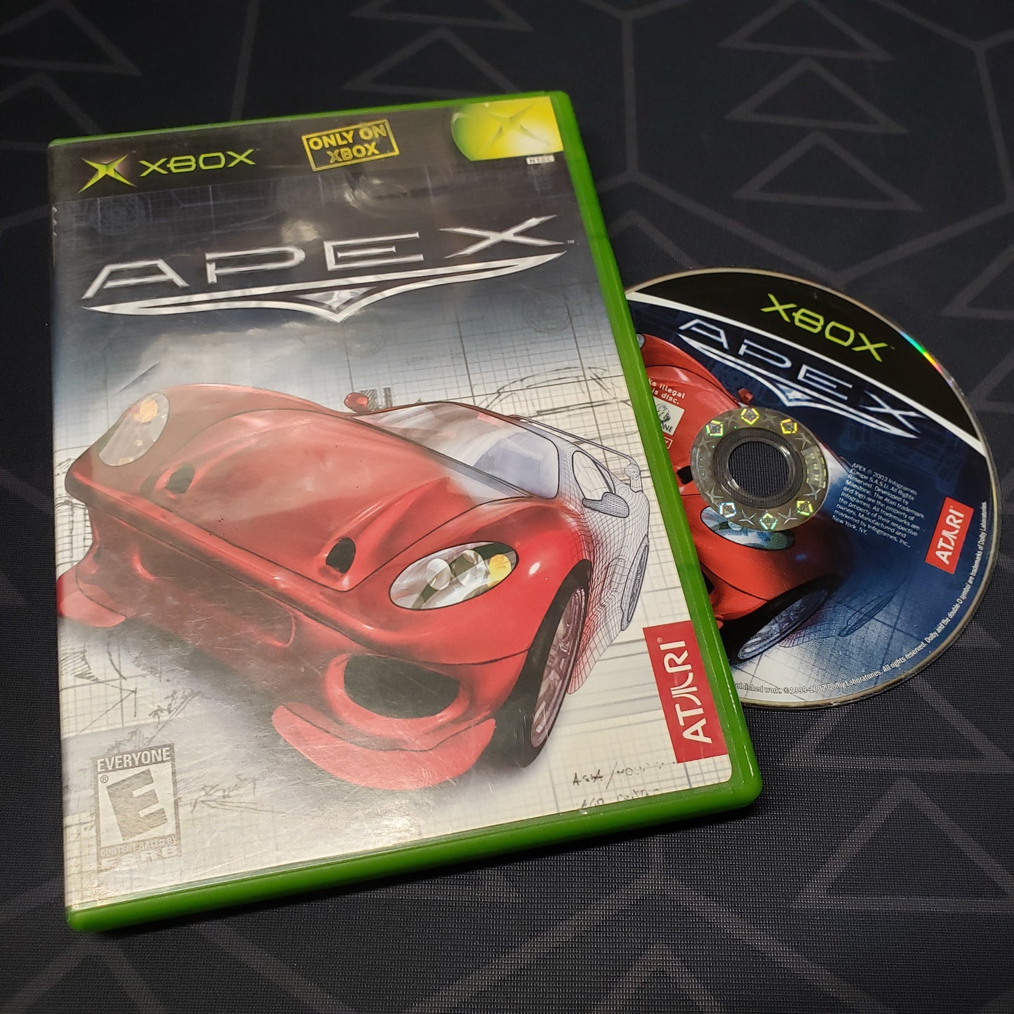 Image shows the case and disc for the video game Apex for the original Xbox