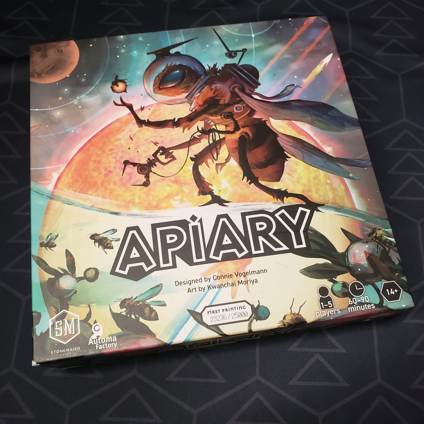 Image shows the front cover of the box of the Apiary board game