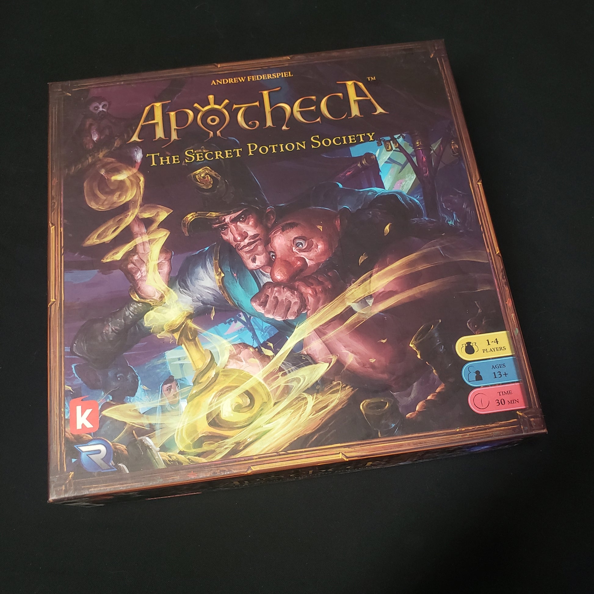 Image shows the front cover of the box of the Apotheca board game