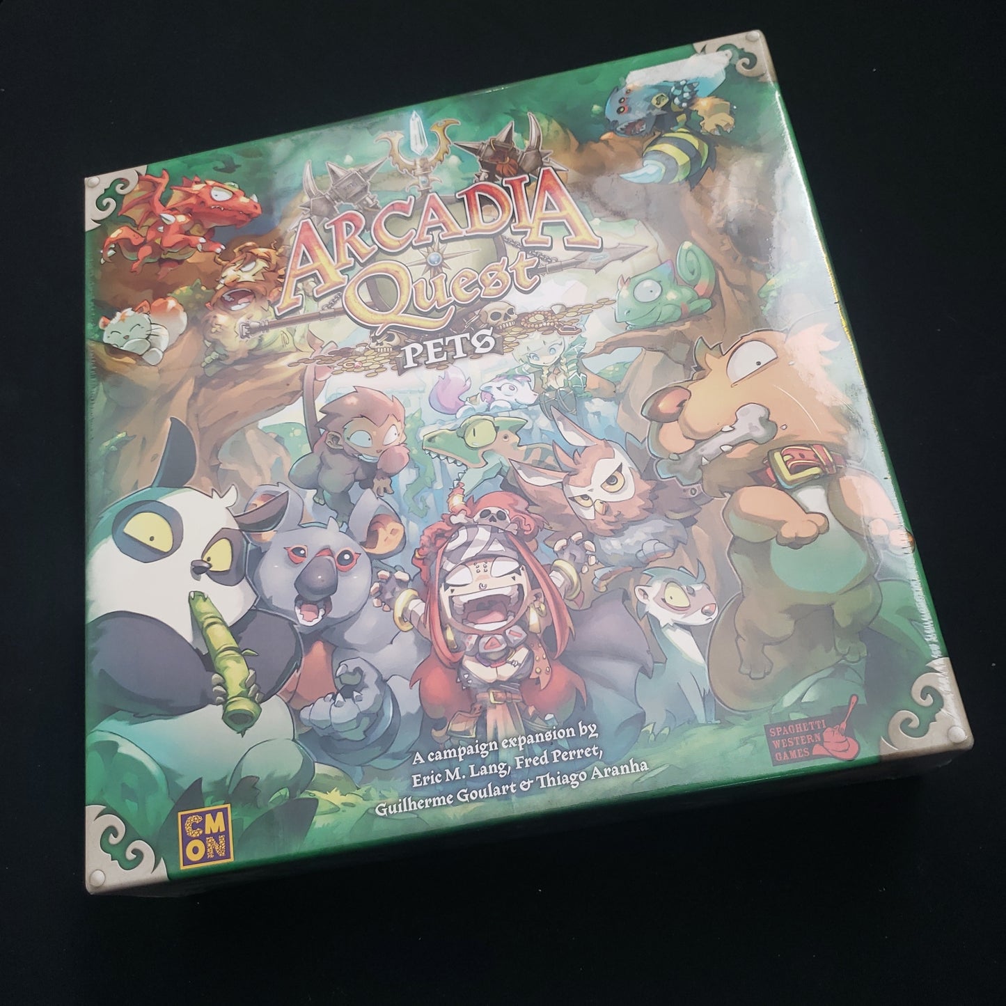Image shows the front cover of the box of the Pets expansion for the board game Arcadia Quest