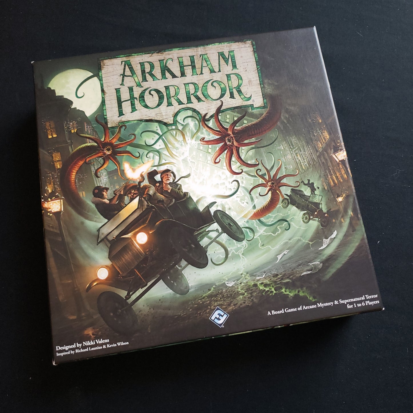 Image shows the front cover of the box of the Arkham Horror: Third Edition board game