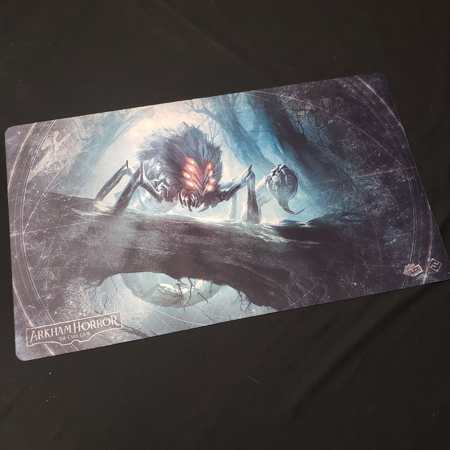 Image shows a playmat featured the Altered Beast artwork for the Arkham Horror Card Game