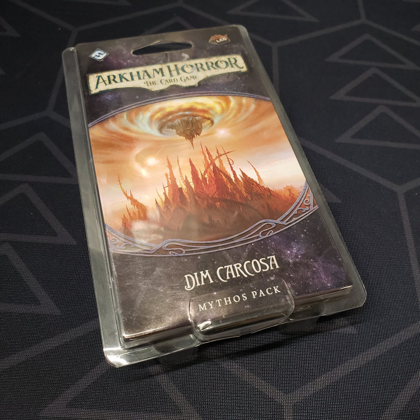 Image shows the front of the package for the Dim Carcosa Mythos Pack expansion for Arkham Horror: The Card Game