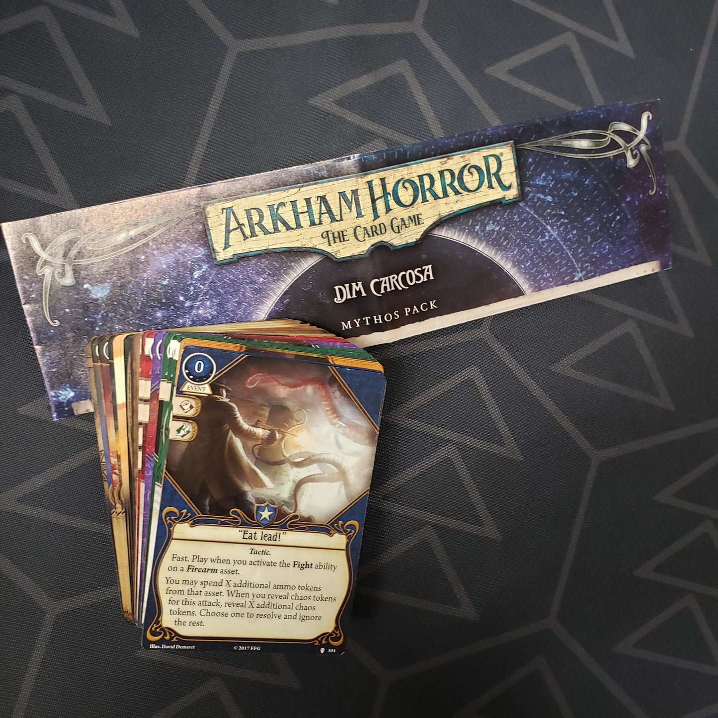 Image shows the instructions and cards for the Dim Carcosa Mythos Pack expansion for Arkham Horror: The Card Game