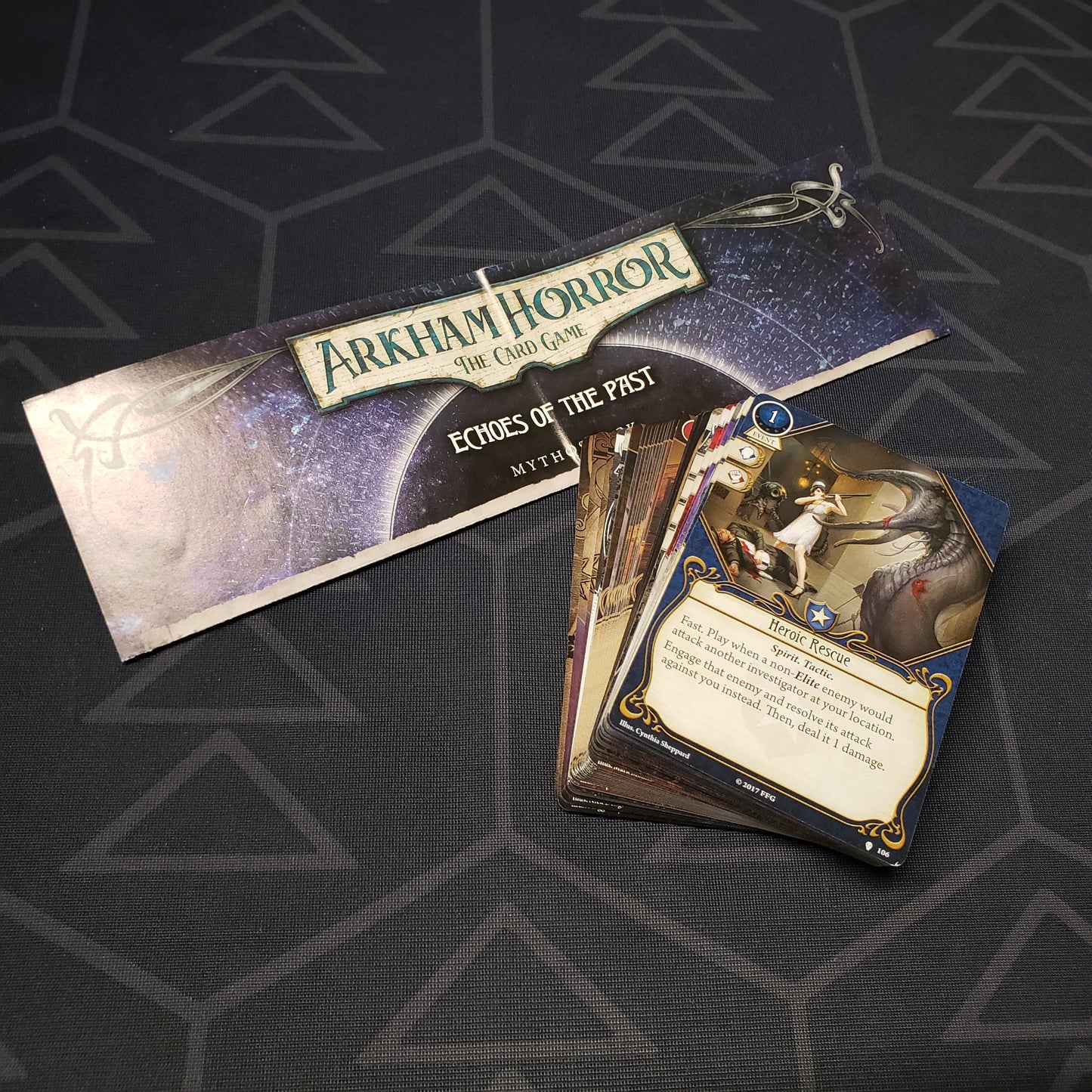 Image shows the cards & instructions for the Echoes of the Past Mythos Pack expansion for Arkham Horror: The Card Game