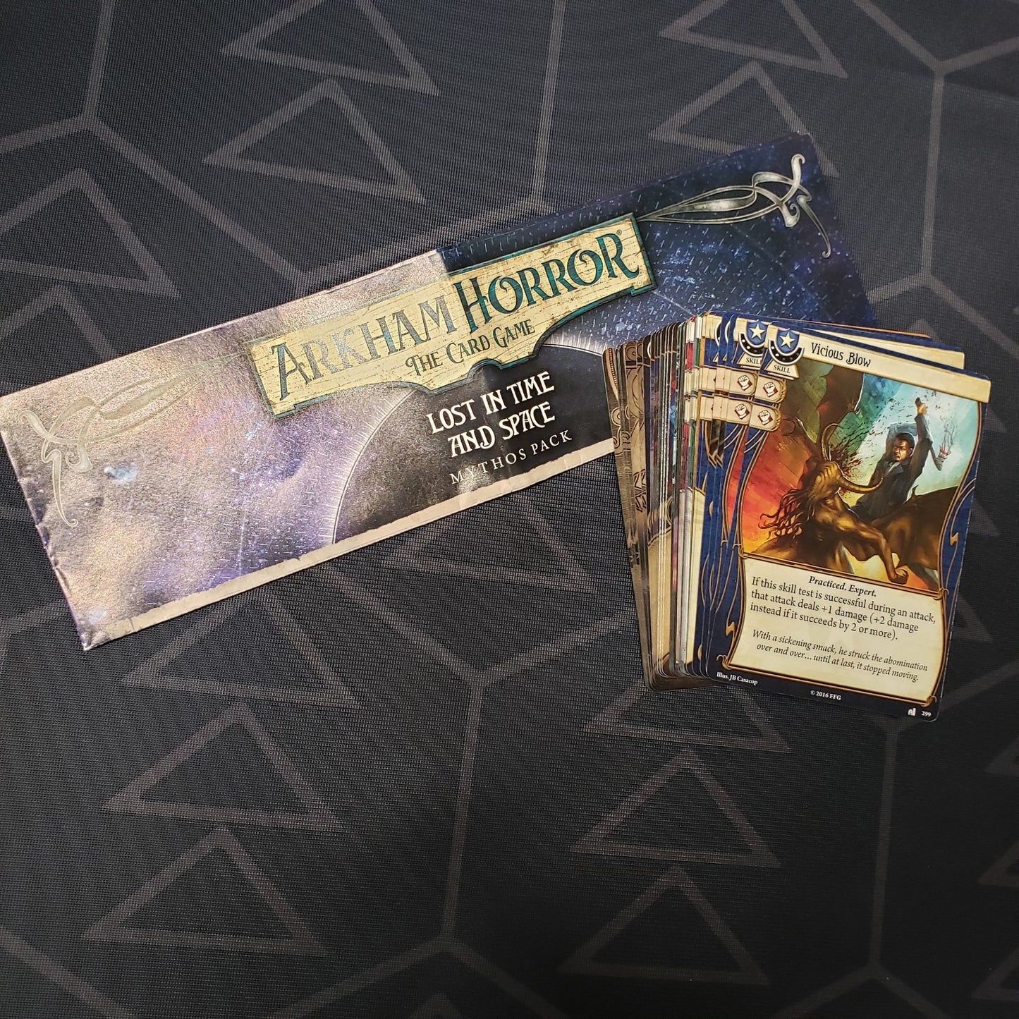 Image shows the instructions and cards for the Lost in Time and Space Mythos Pack expansion for Arkham Horror: The Card Game