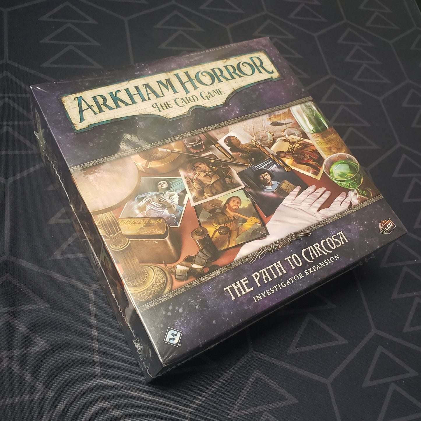 Image shows the front of the box for the Path to Carcosa Investigator expansion from the Arkham Horror Card Game