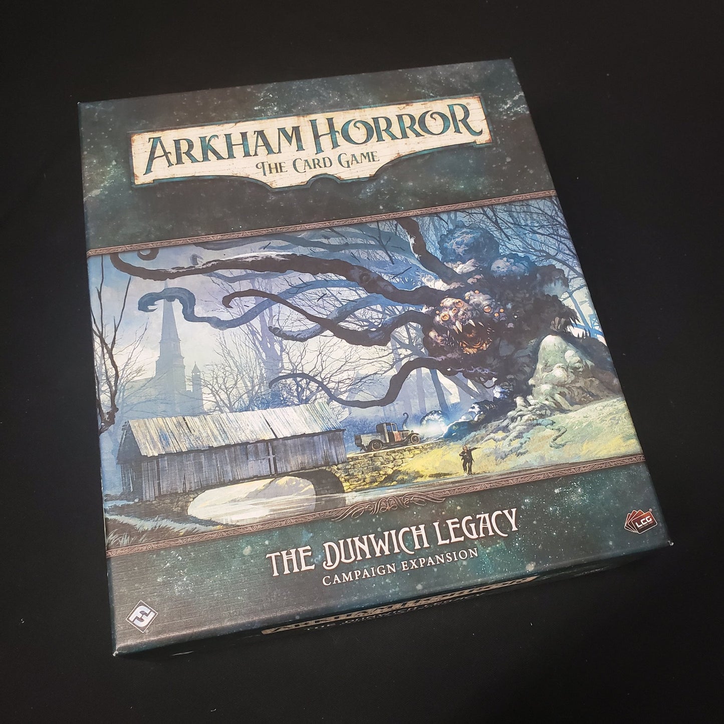 Image shows the front cover of the box for the Dunwich Legacy Campaign expansion from the Arkham Horror card game