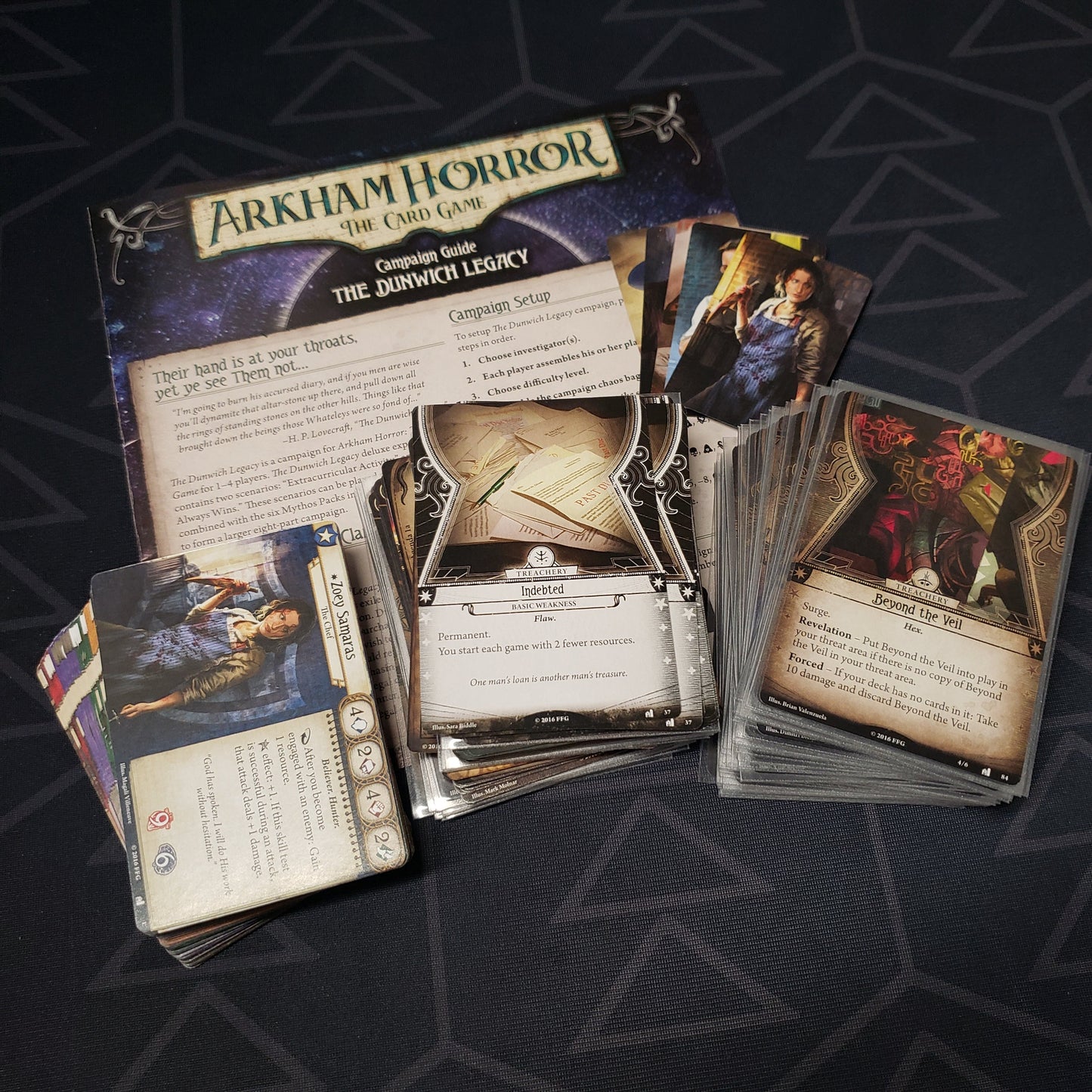 Image shows the cards & instructions for the Dunwich Legacy expansion for the Arkham Horror card game