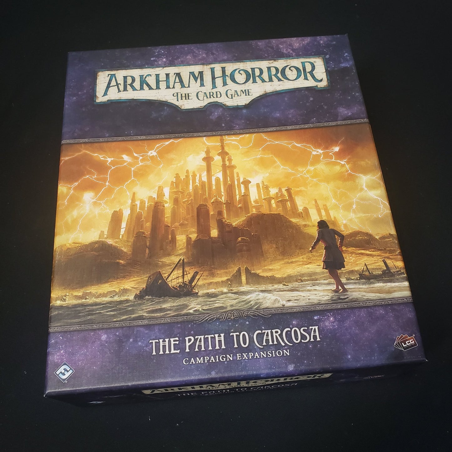 Image shows the front cover of the box for the Path to Carcosa Campaign expansion from the Arkham Horror Card Game