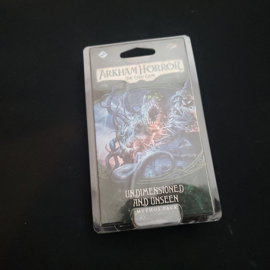Image shows the front of the package for the Undimensioned and Unseen Mythos Pack for the Arkham Horror card game