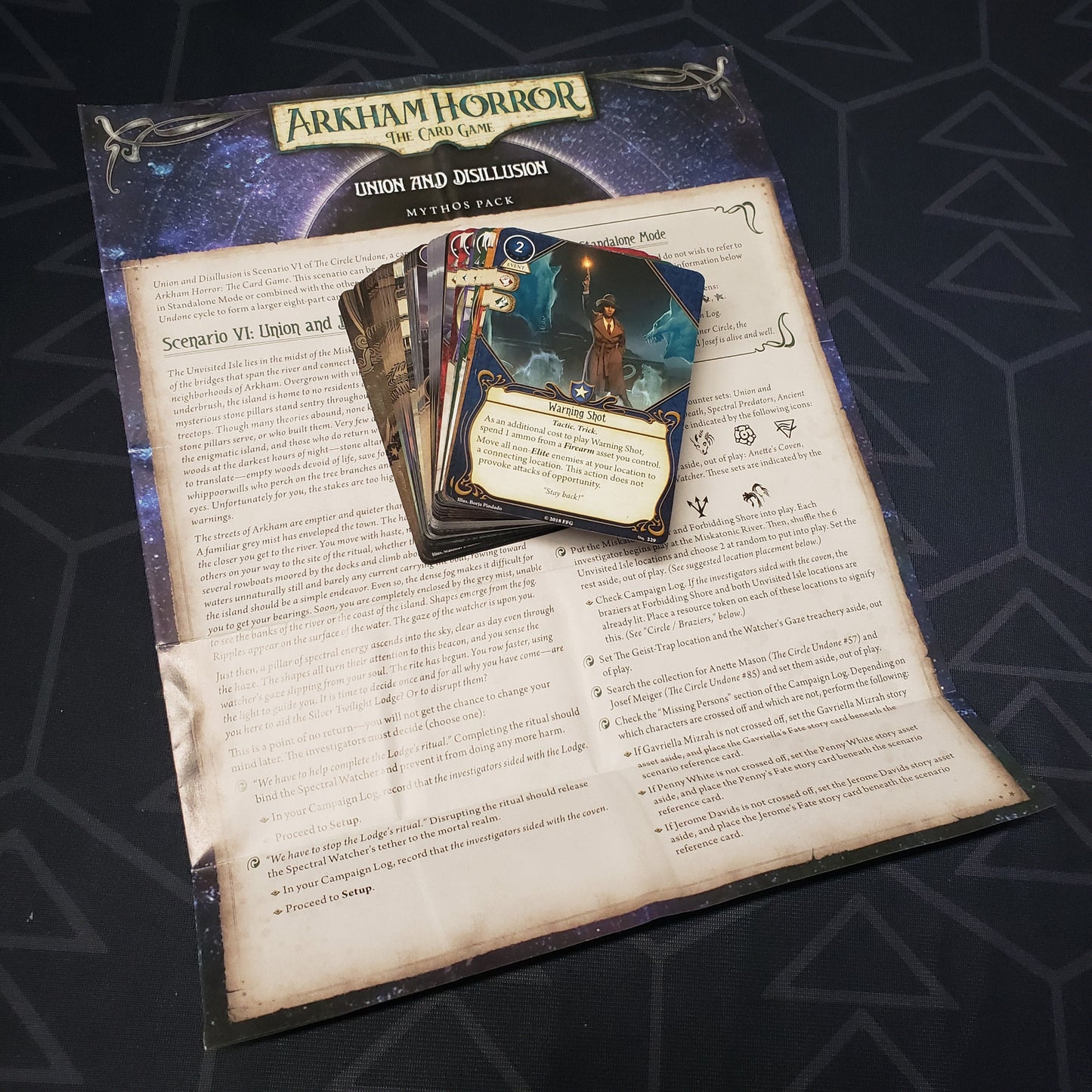 Image shows the cards & instruction sheet for the Union and Disillusion Mythos pack for the card game Arkham Horror