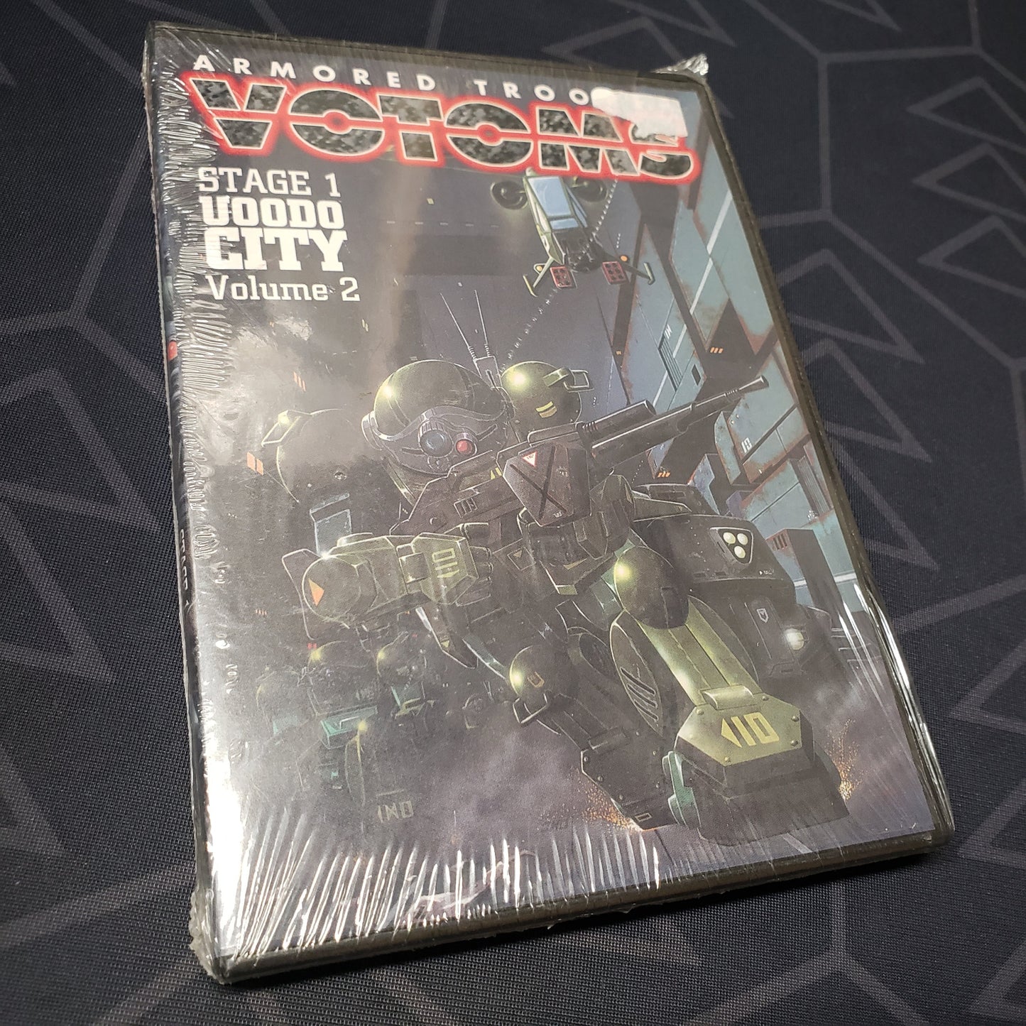 Image shows the front of the case for the Stage 1, Volume 2: Uoodo City episode disc of the anime TV series Armored Trooper Votoms on DVD