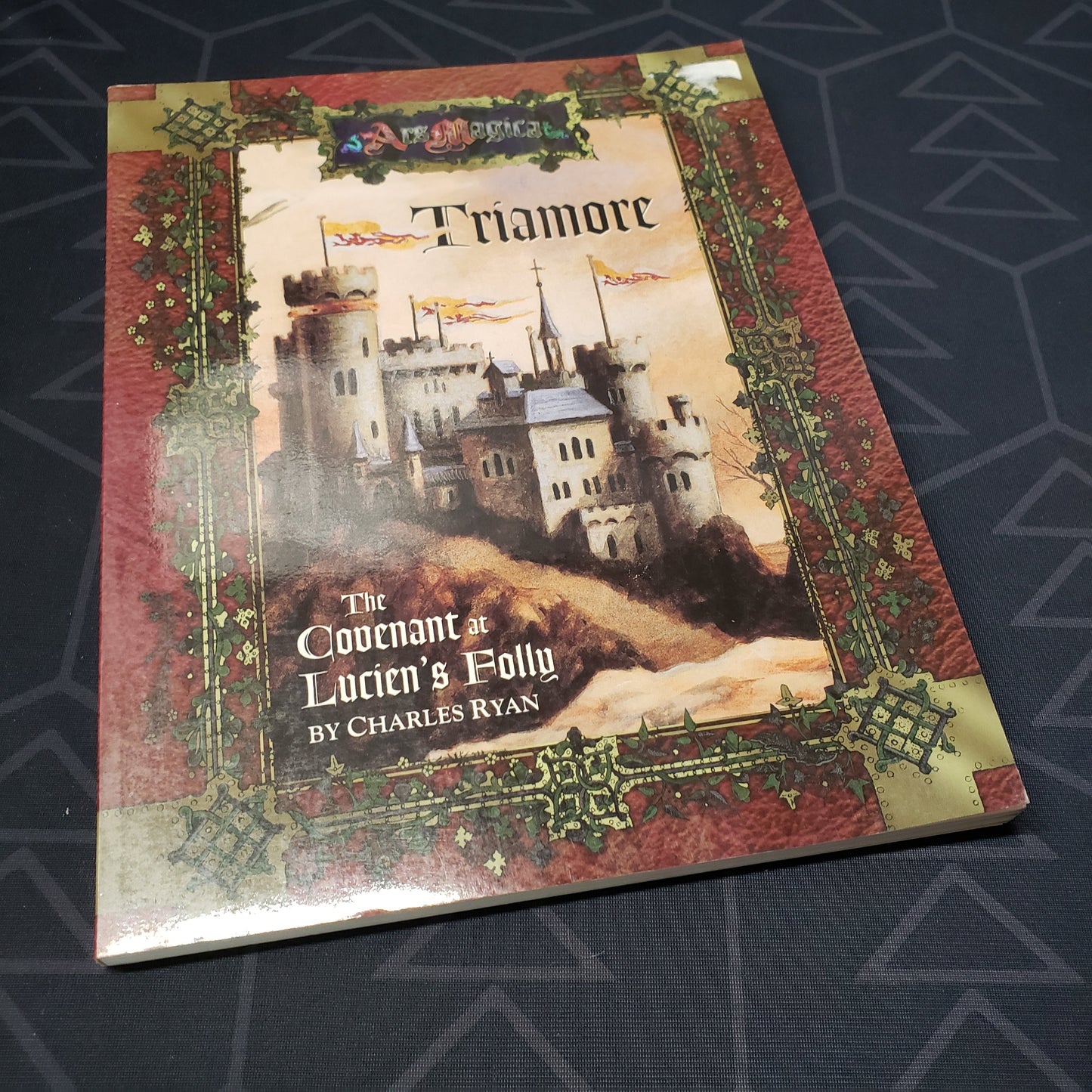 Image shows the front cover of the Triamore: The Covenant at Lucien's Folly book for the roleplaying game Ars Magica 4E