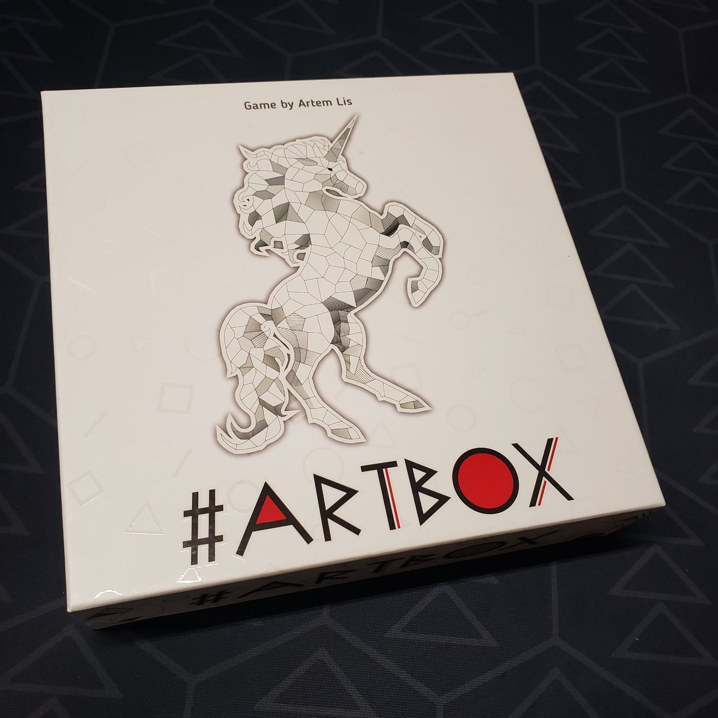 Image shows the front cover of the box for the #ARTBOX board game
