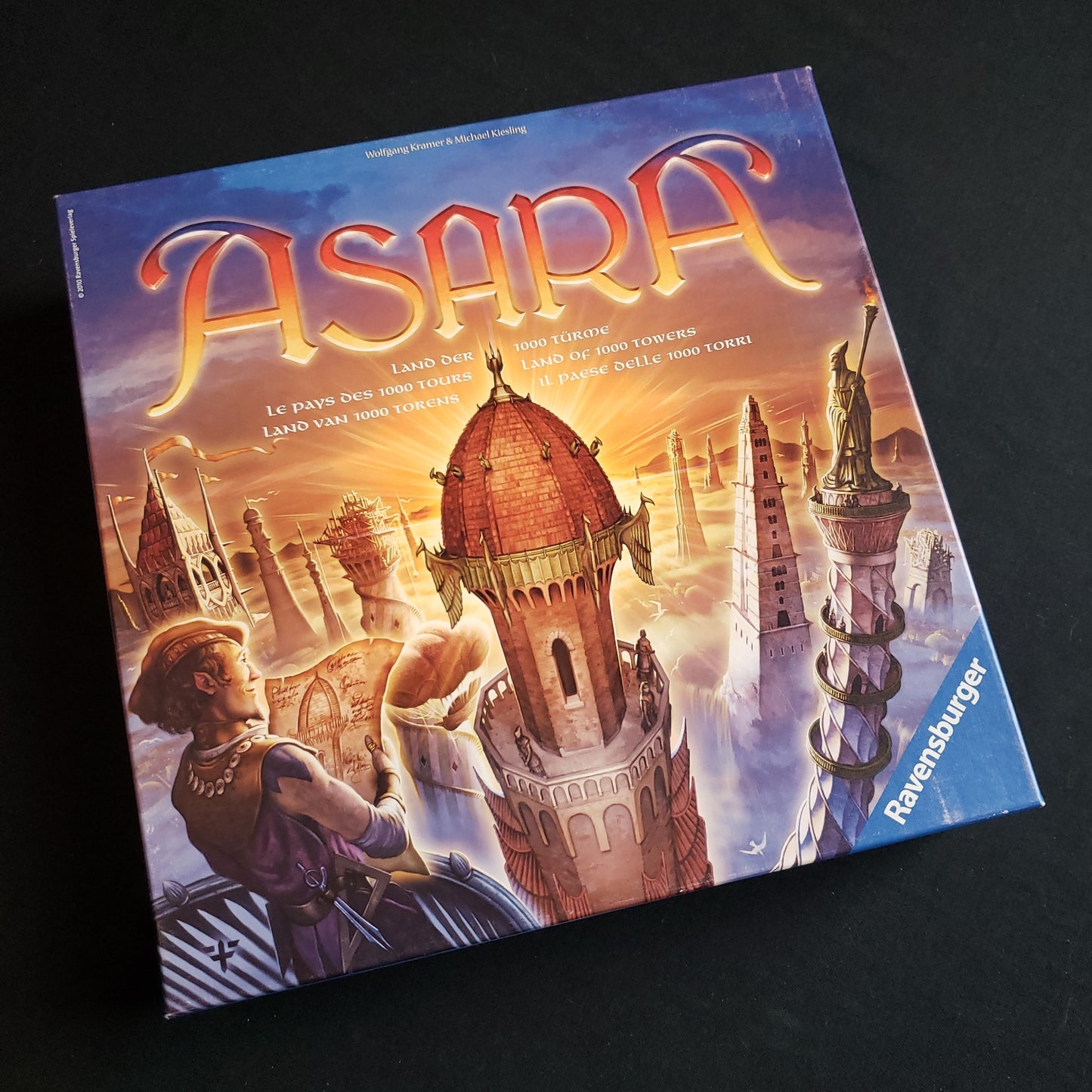 Image shows the front cover of the box of the Asara board game