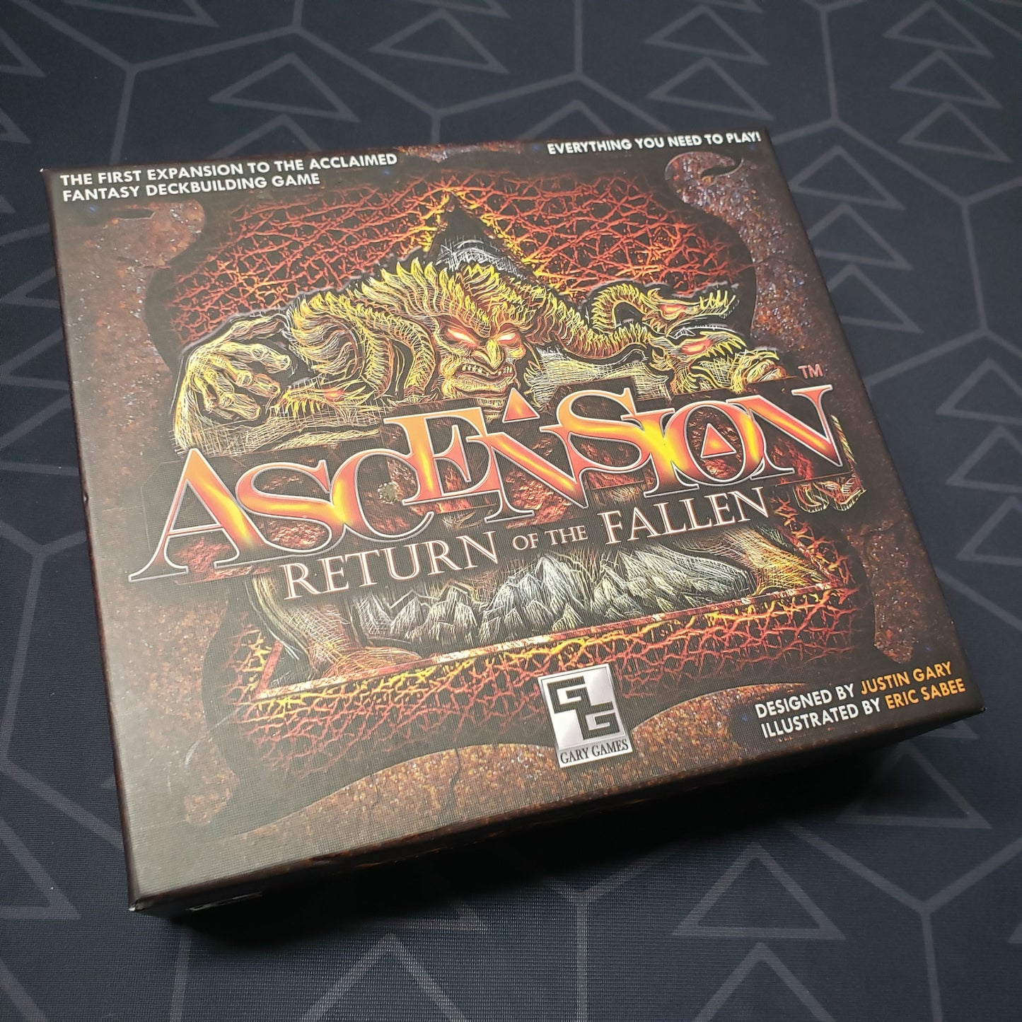Image shows the front cover of the box of the Return of the Fallen expansion for the card game Ascension