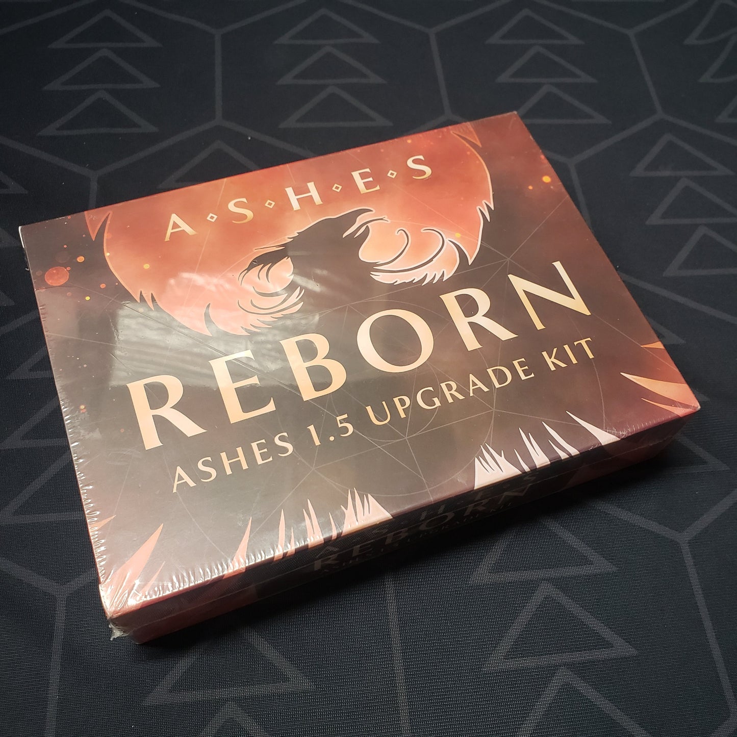 Image shows the front cover of the box for the Reborn: 1.5 Upgrade Kit for the card game Ashes: Rise of the Phoenoxborn