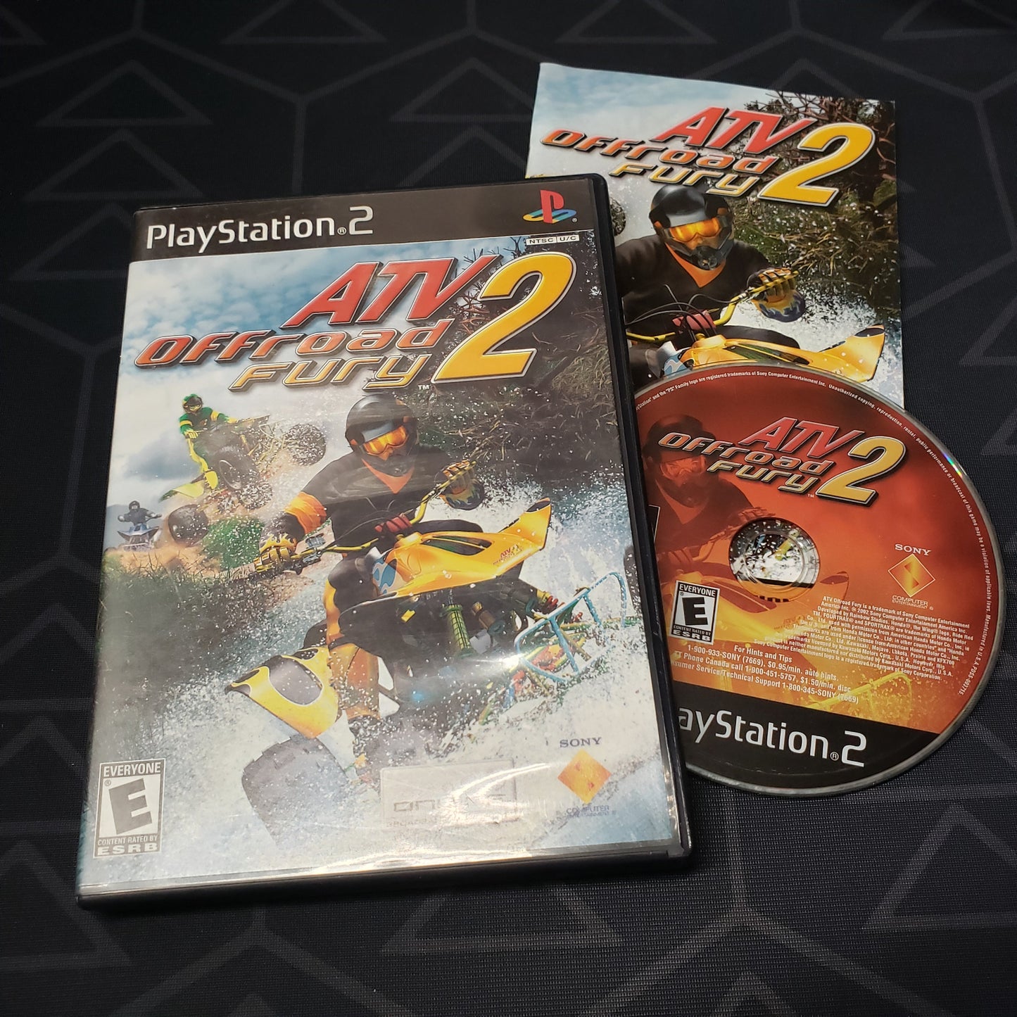 Image shows the case, manual and disc for the video game ATV Offroad Fury 2 for Playstation 2
