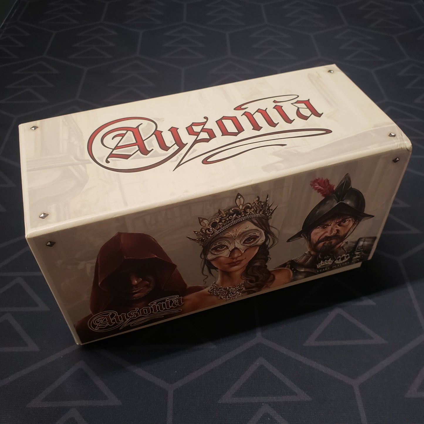 Image shows the front cover of the Kickstarter Collection Edition box for the card game Ausonia