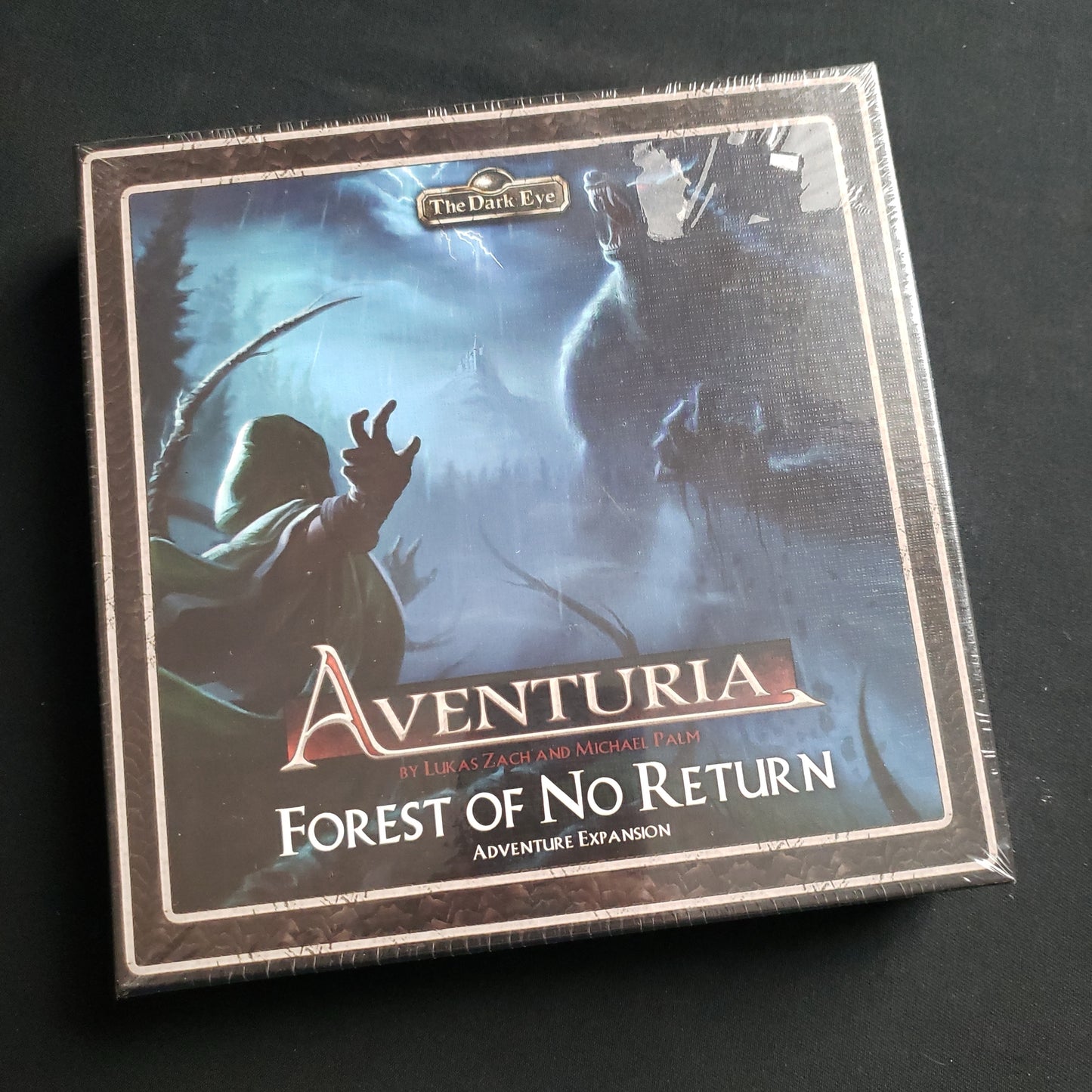 Image shows the front cover of the box of the Forest of No Return expansion for the Aventuria Card Game