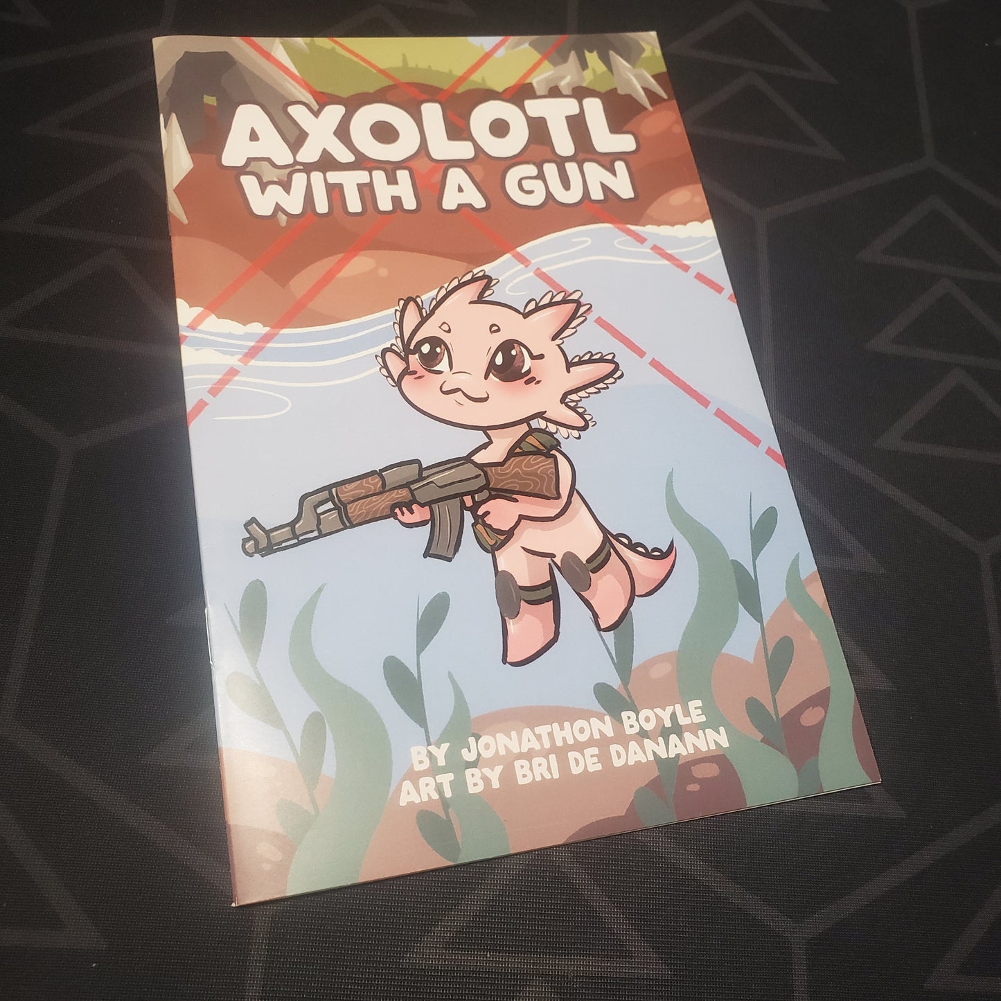 Image shows the front cover of the Axolotl With A Gun roleplaying game zine