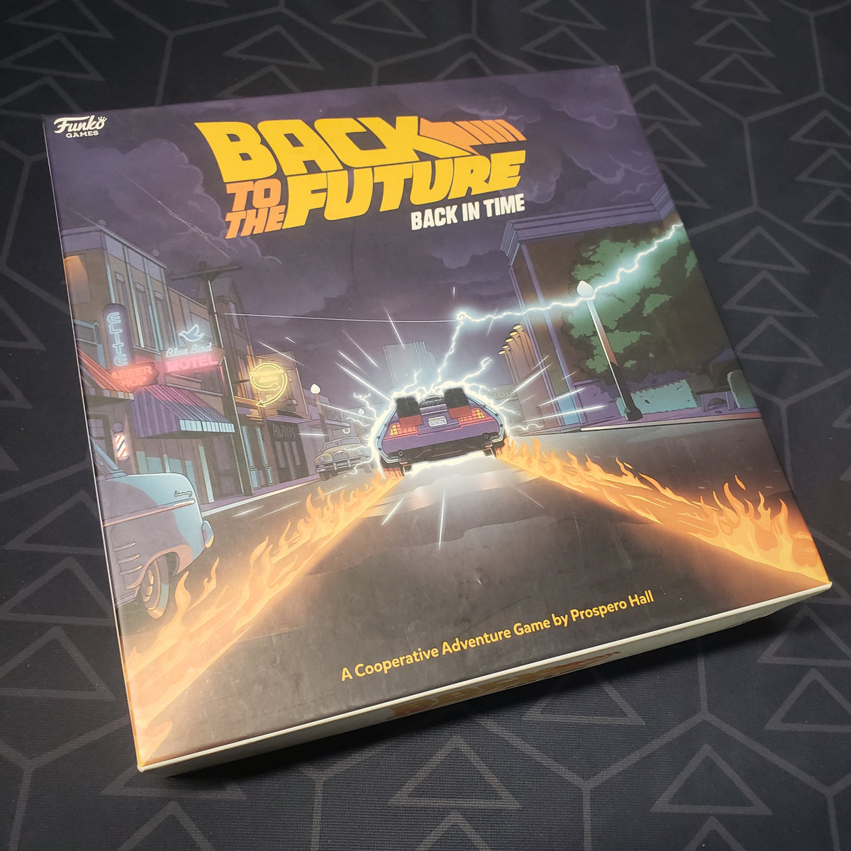 Image shows the front cover of the box of the Back To The Future: Back In Time board game