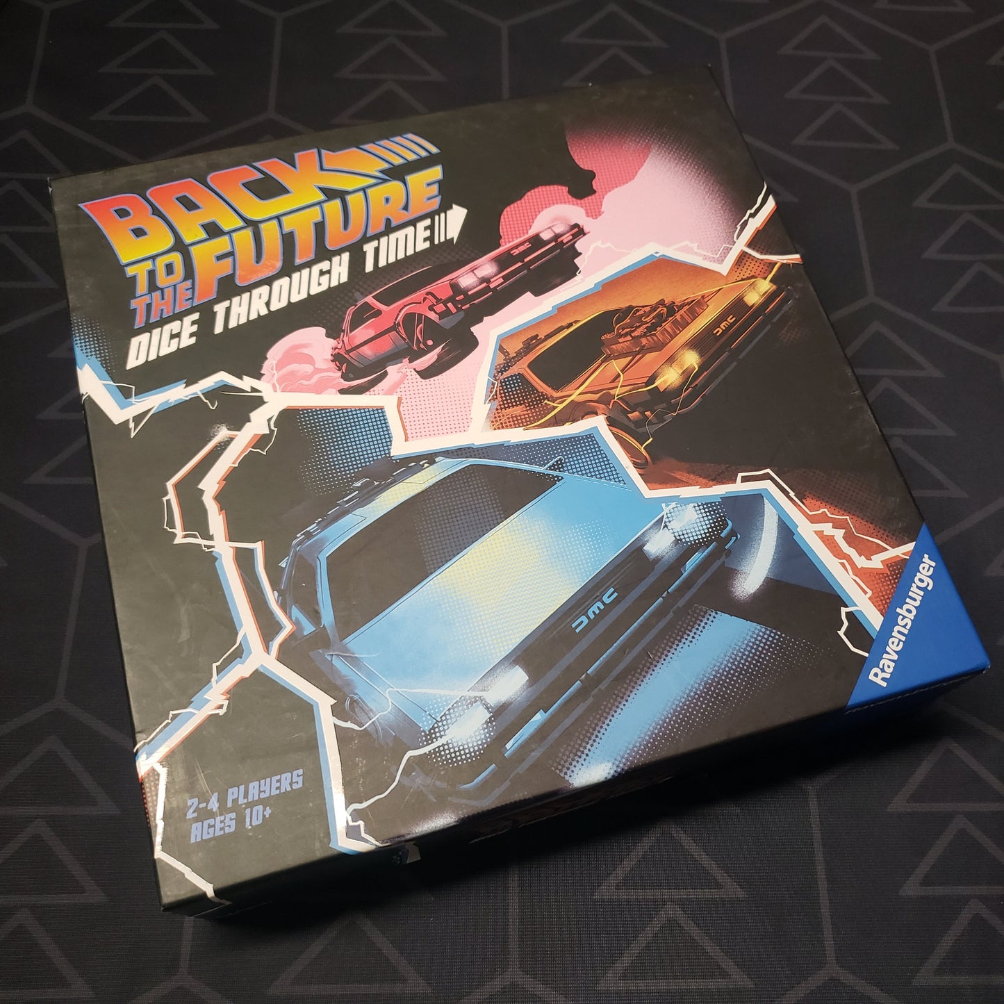 Image shows the front cover of the box of the Back to the Future: Dice Through Time board game